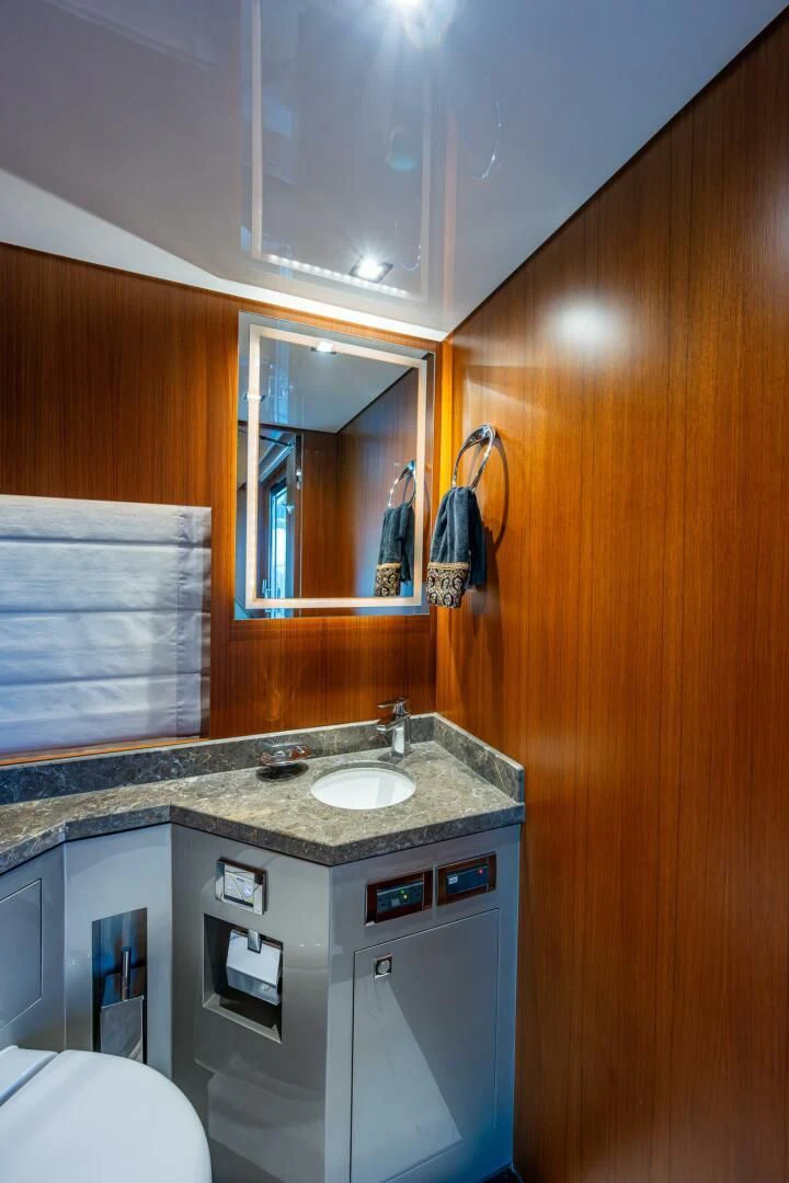 a bathroom with a sink and a mirror aboard MOIRA CINCO Yacht for Sale