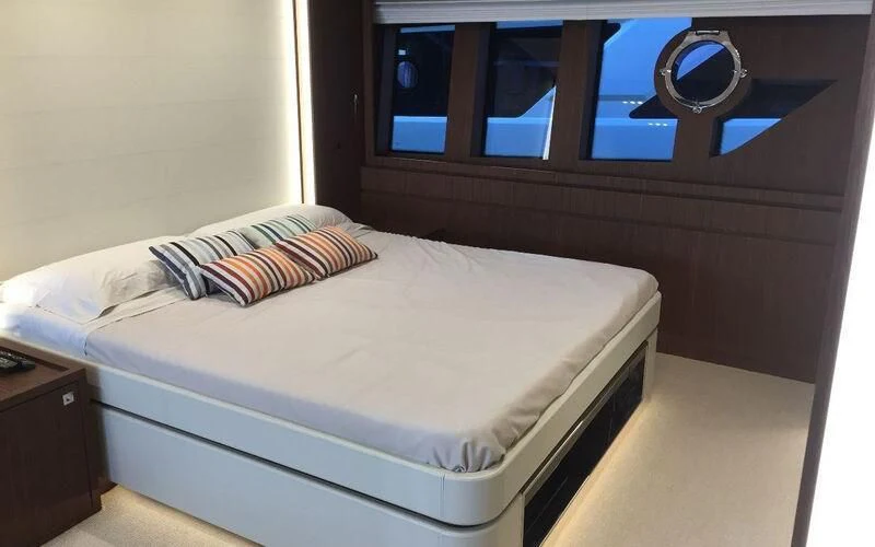a bed with a white sheet aboard MOIRA CINCO Yacht for Sale