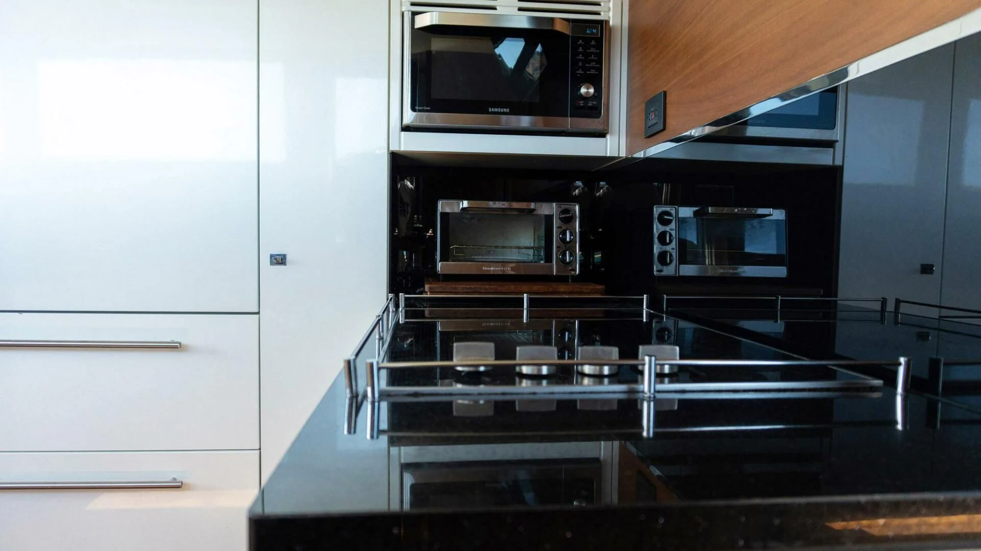 a kitchen with a stove and microwave aboard MOIRA CINCO Yacht for Sale
