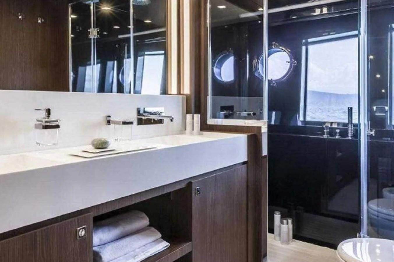 a bathroom with a large mirror aboard MOIRA CINCO Yacht for Sale