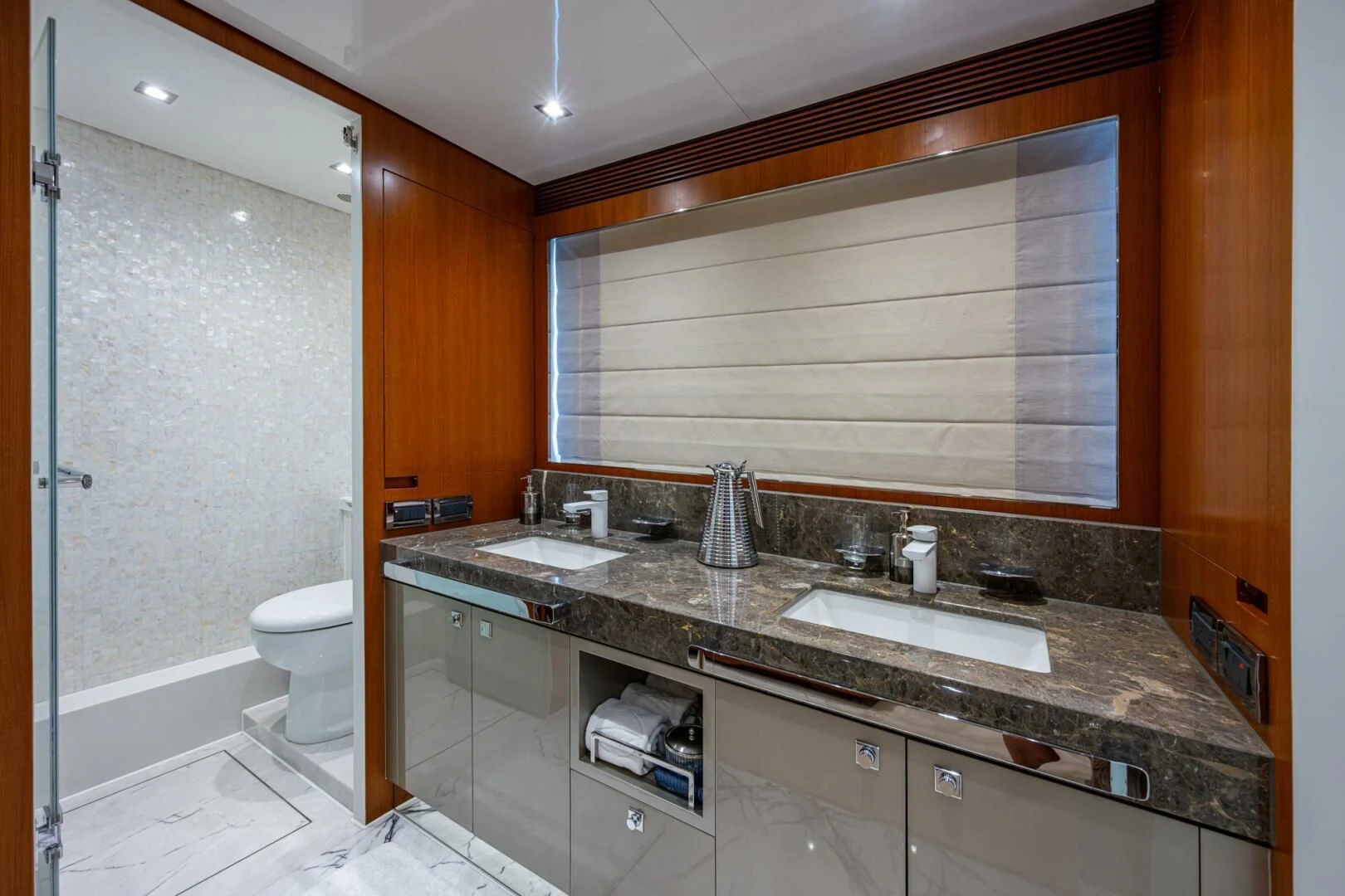 a bathroom with a countertop sink and a toilet aboard MOIRA CINCO Yacht for Sale