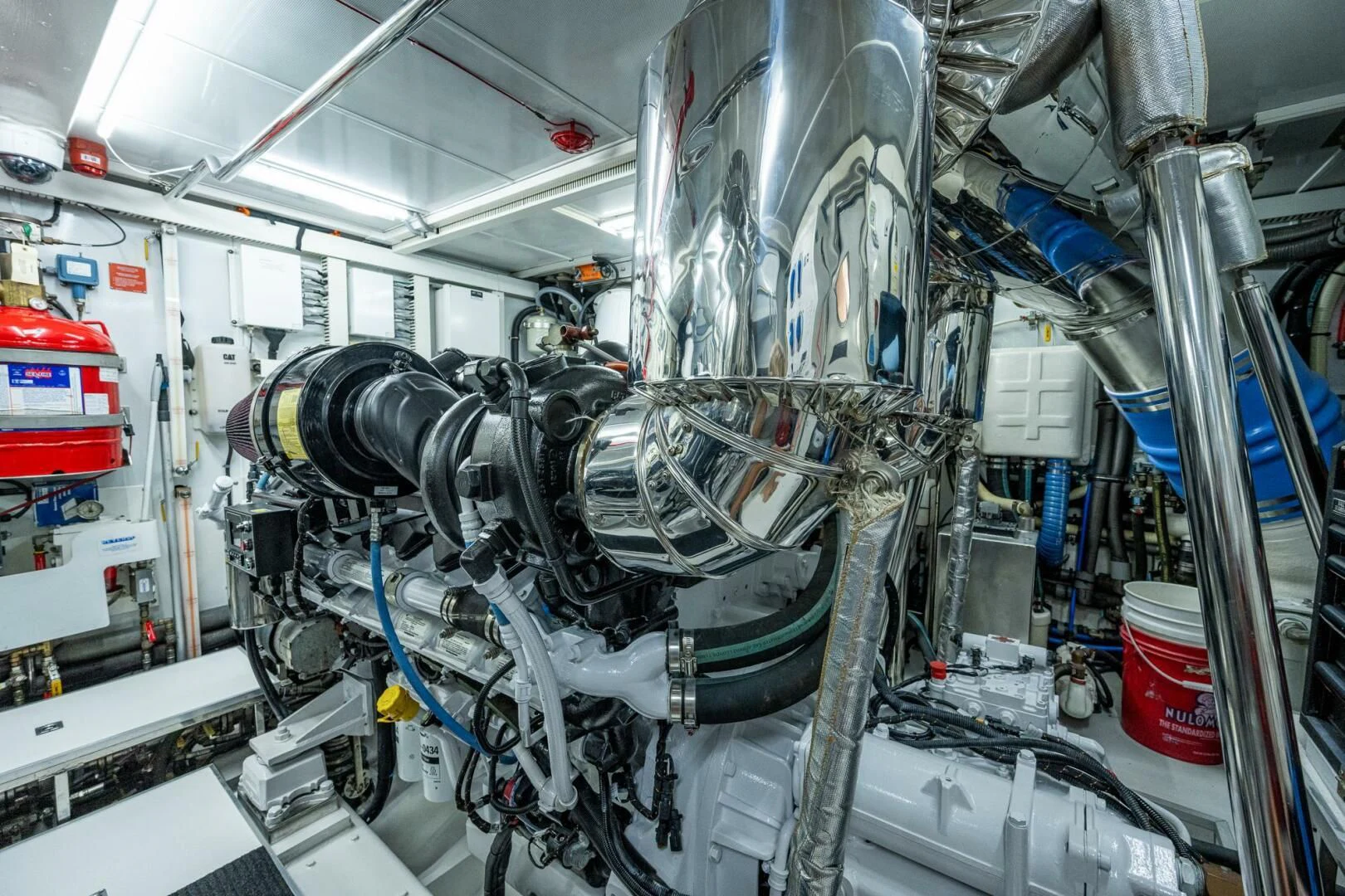 a room with several wires and pipes aboard MOIRA CINCO Yacht for Sale