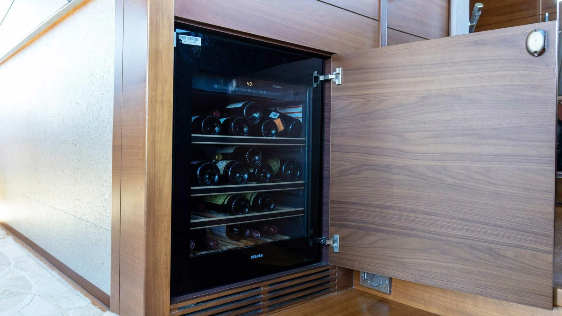 a black cabinet with a glass door aboard MOIRA CINCO Yacht for Sale