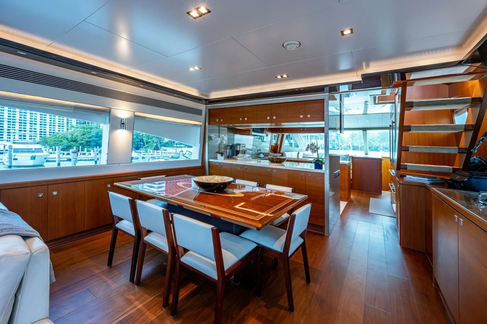 a kitchen with a dining table aboard MOIRA CINCO Yacht for Sale