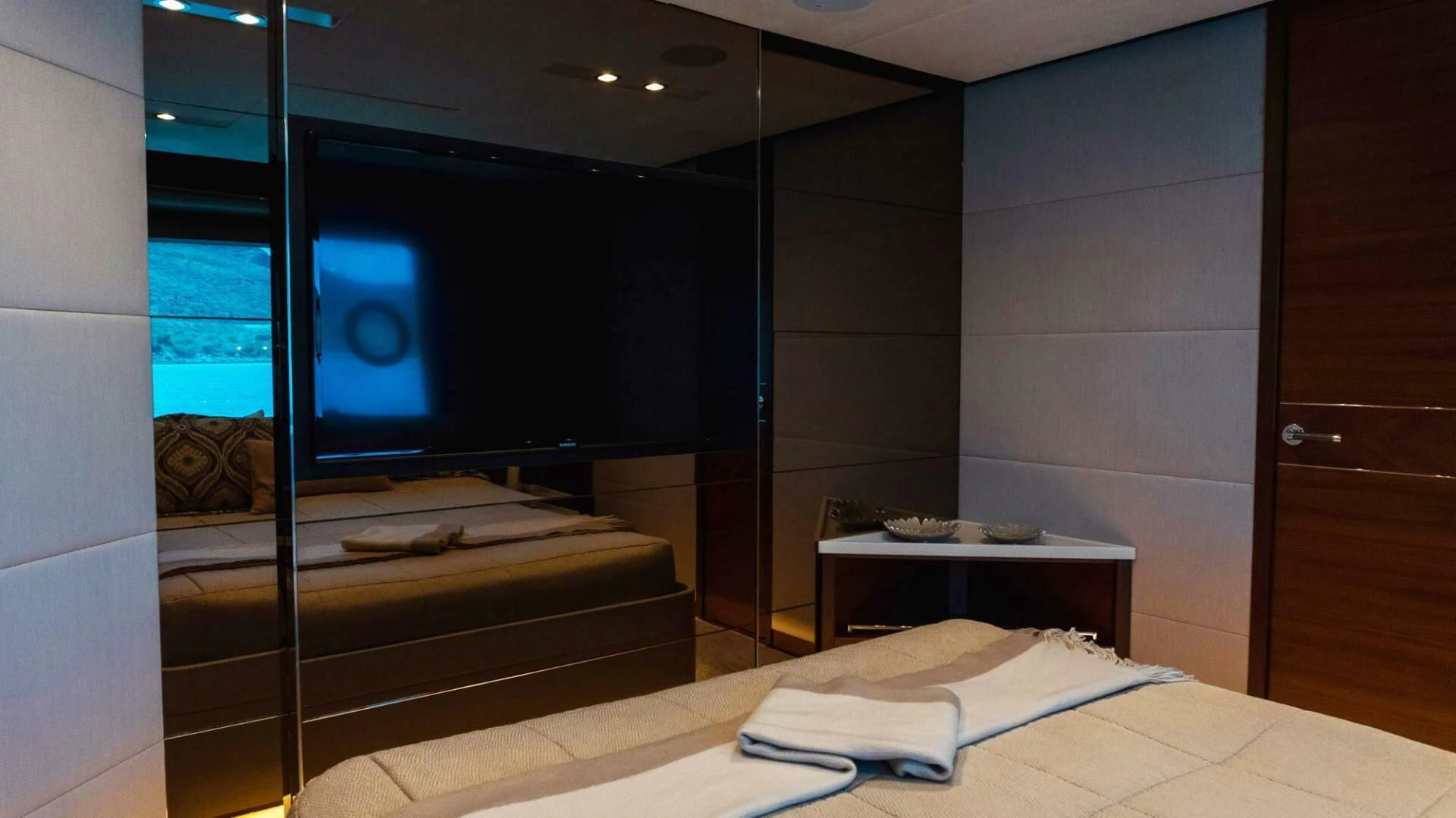 a room with a tv and a bed aboard MOIRA CINCO Yacht for Sale