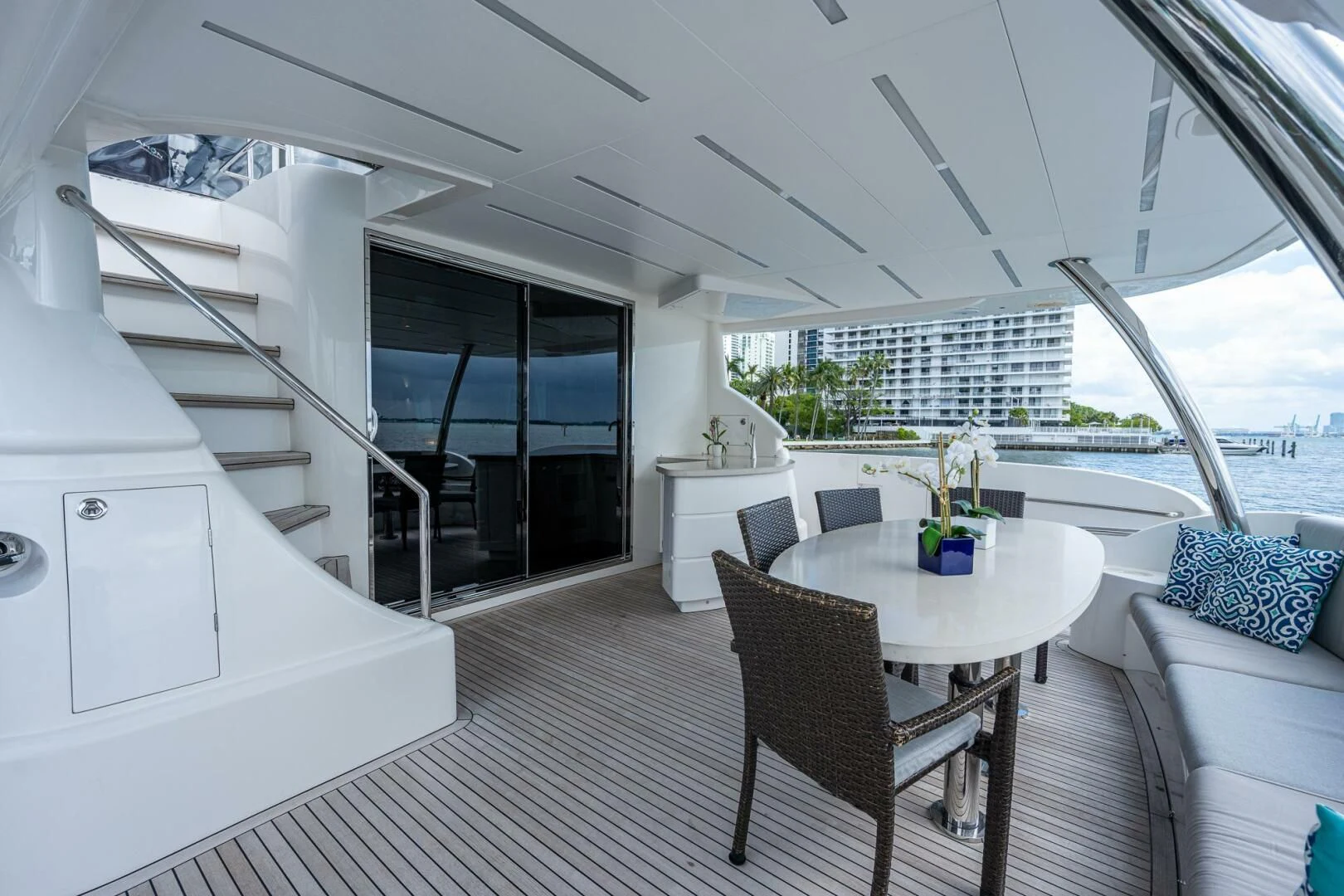 a white living room with a large open window aboard MOIRA CINCO Yacht for Sale