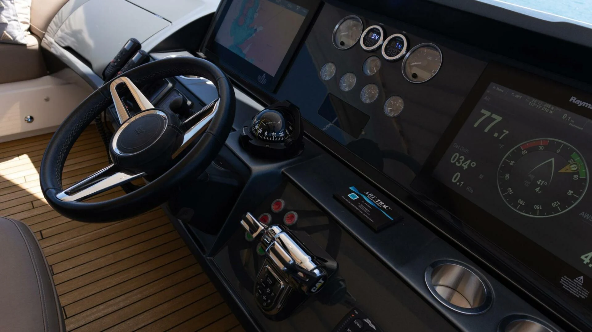 a car with a steering wheel aboard MOIRA CINCO Yacht for Sale