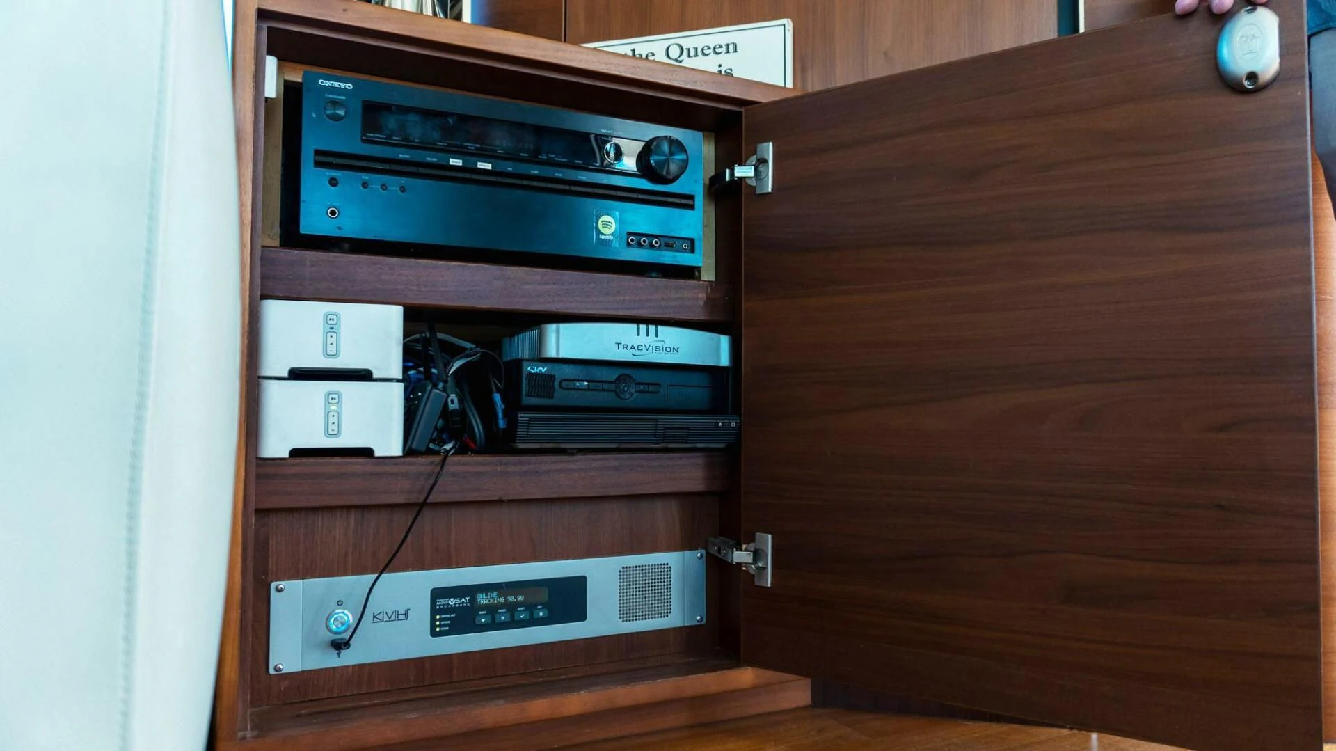 a wood cabinet with a stereo and a radio on it aboard MOIRA CINCO Yacht for Sale