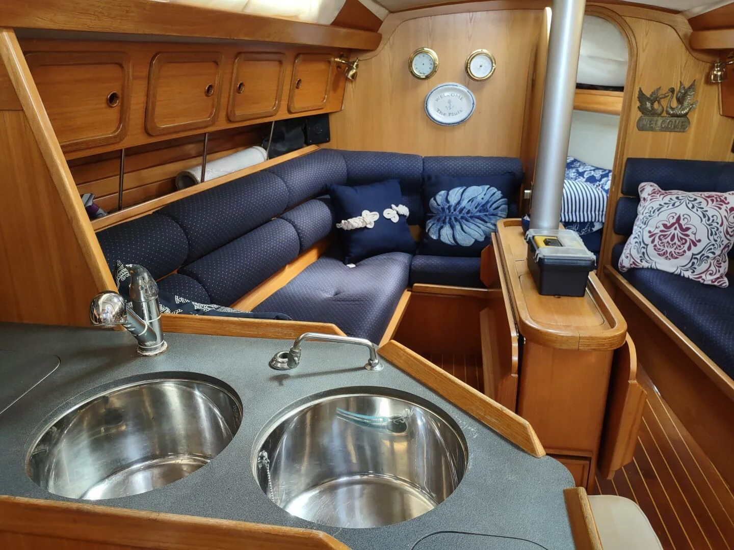 a kitchen sink and a couch in a cabin aboard ILLUSION XI Yacht for Sale
