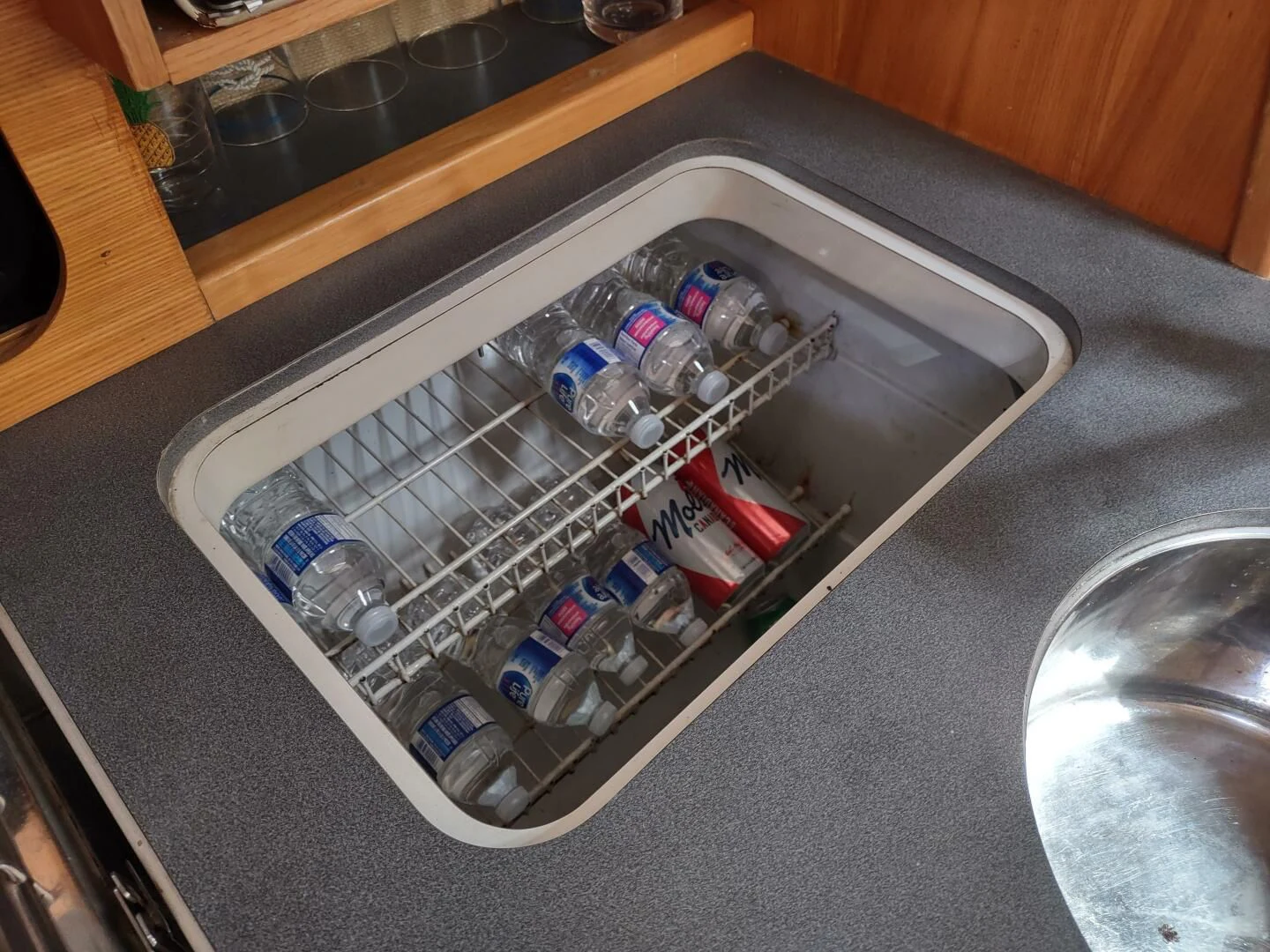 a cooler full of bottles aboard ILLUSION XI Yacht for Sale