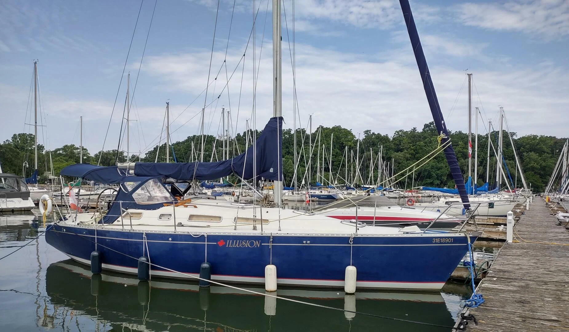 a boat docked at a pier aboard ILLUSION XI Yacht for Sale