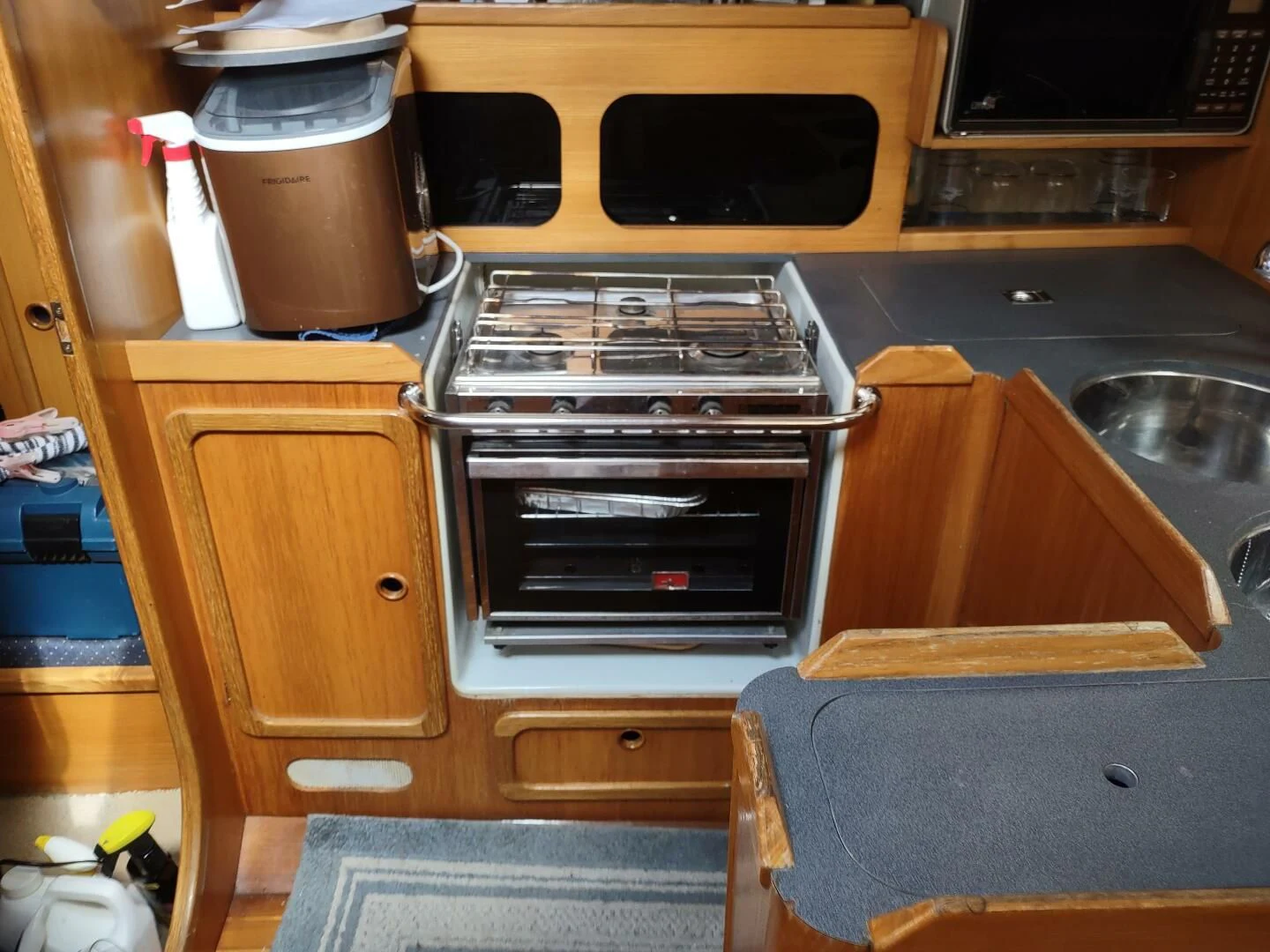a kitchen with a stove and a sink aboard ILLUSION XI Yacht for Sale