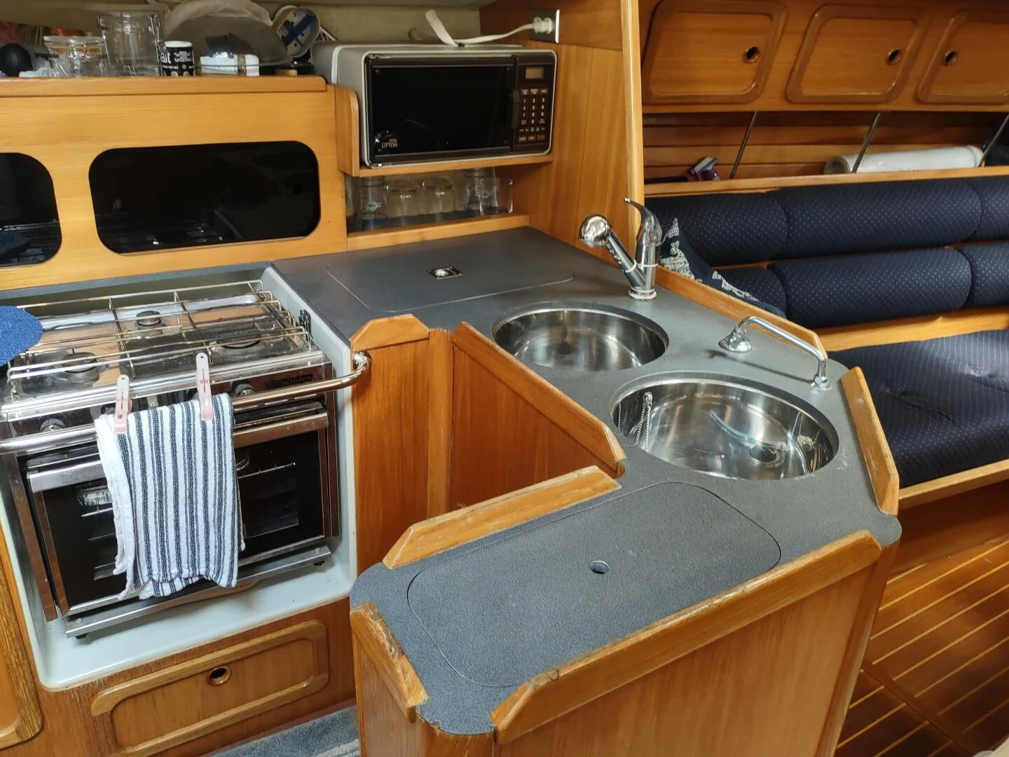 a kitchen with a sink and oven aboard ILLUSION XI Yacht for Sale