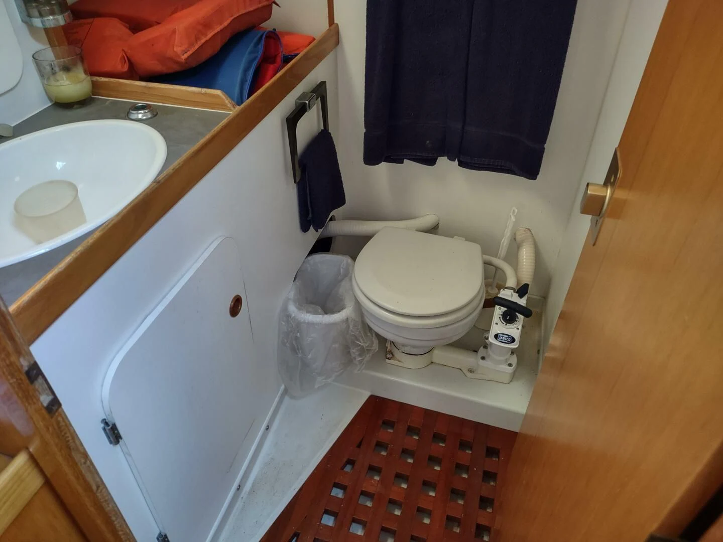 a bathroom with a sink and toilet aboard ILLUSION XI Yacht for Sale