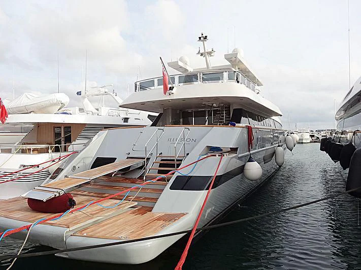 a boat docked at a pier aboard ILLUSION XI Yacht for Sale