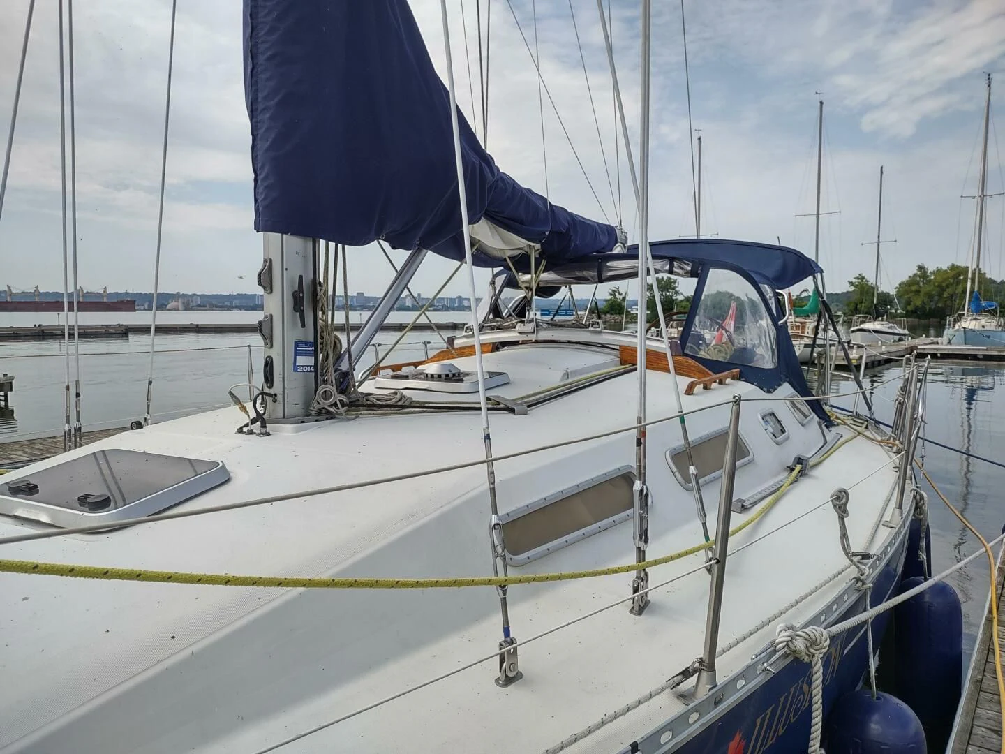 a boat with a flag on the front aboard ILLUSION XI Yacht for Sale