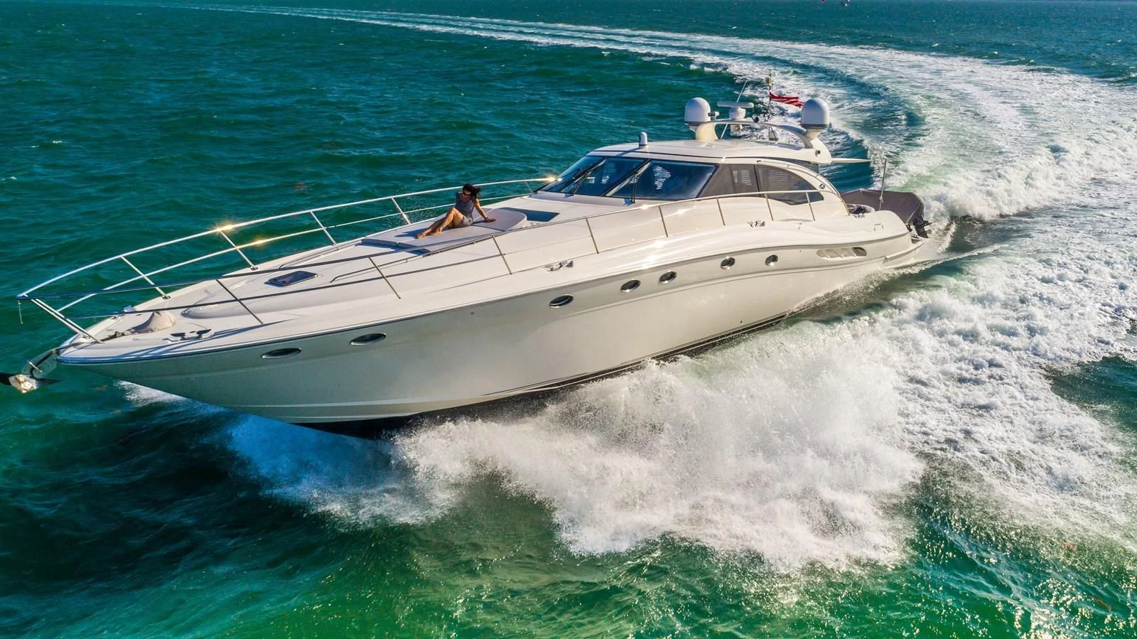 a white boat on the water aboard XANADU Yacht for Sale