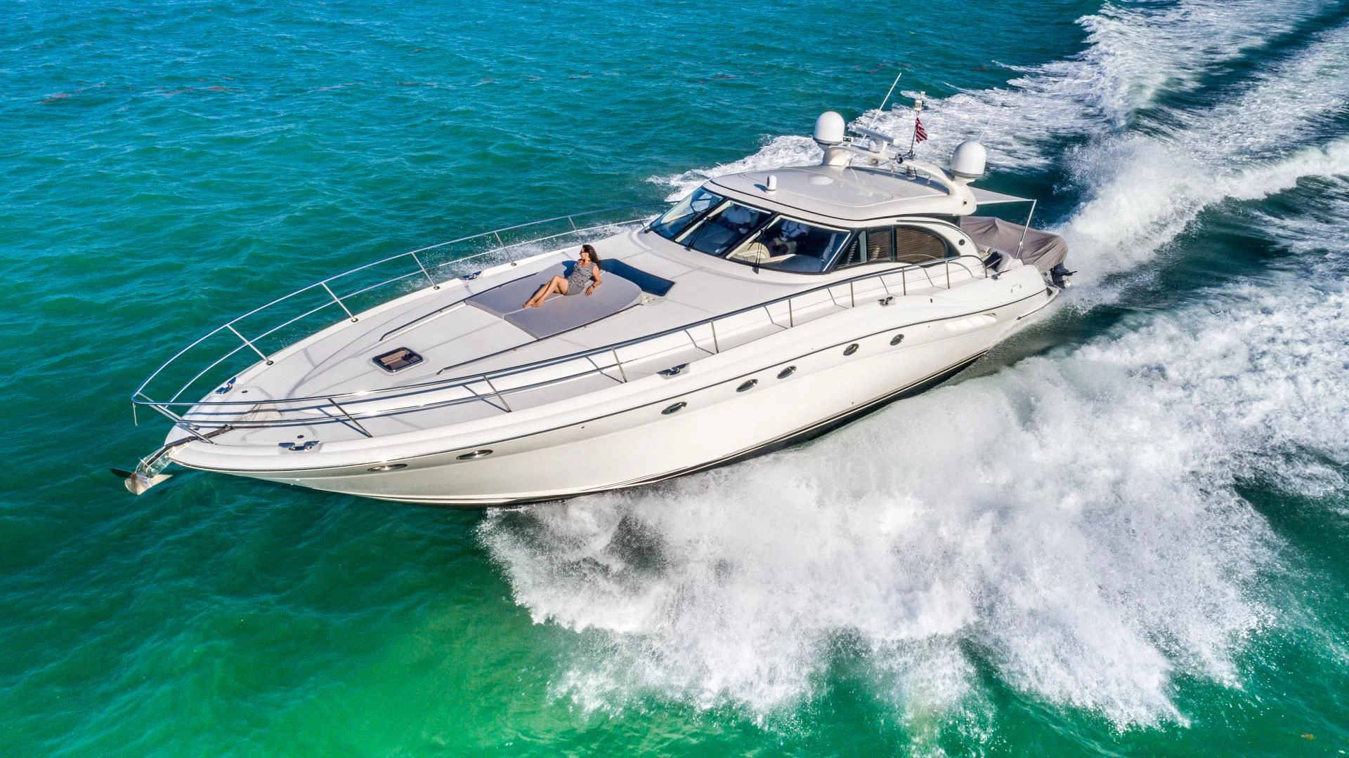 a white boat on the water aboard XANADU Yacht for Sale