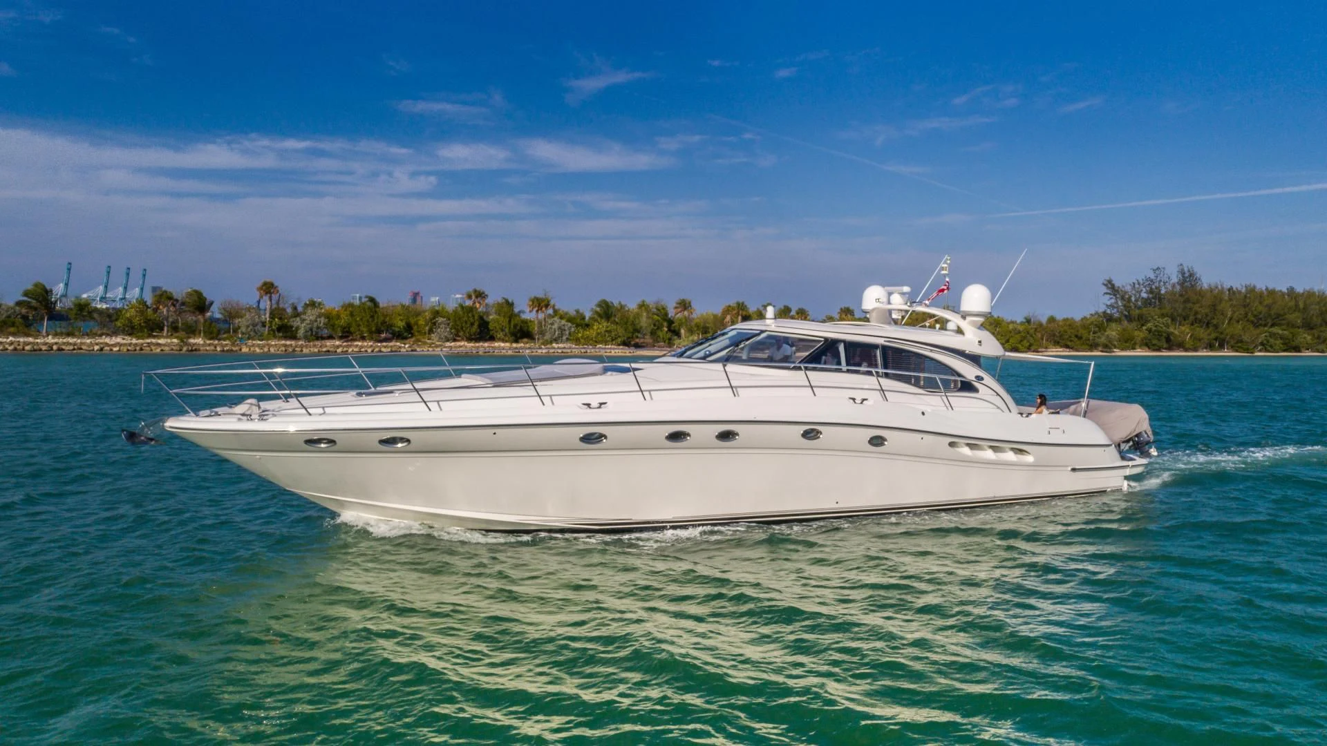 a white boat in the water aboard XANADU Yacht for Sale
