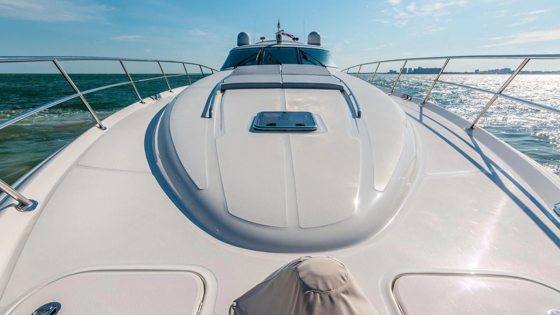 a white boat on a body of water aboard XANADU Yacht for Sale