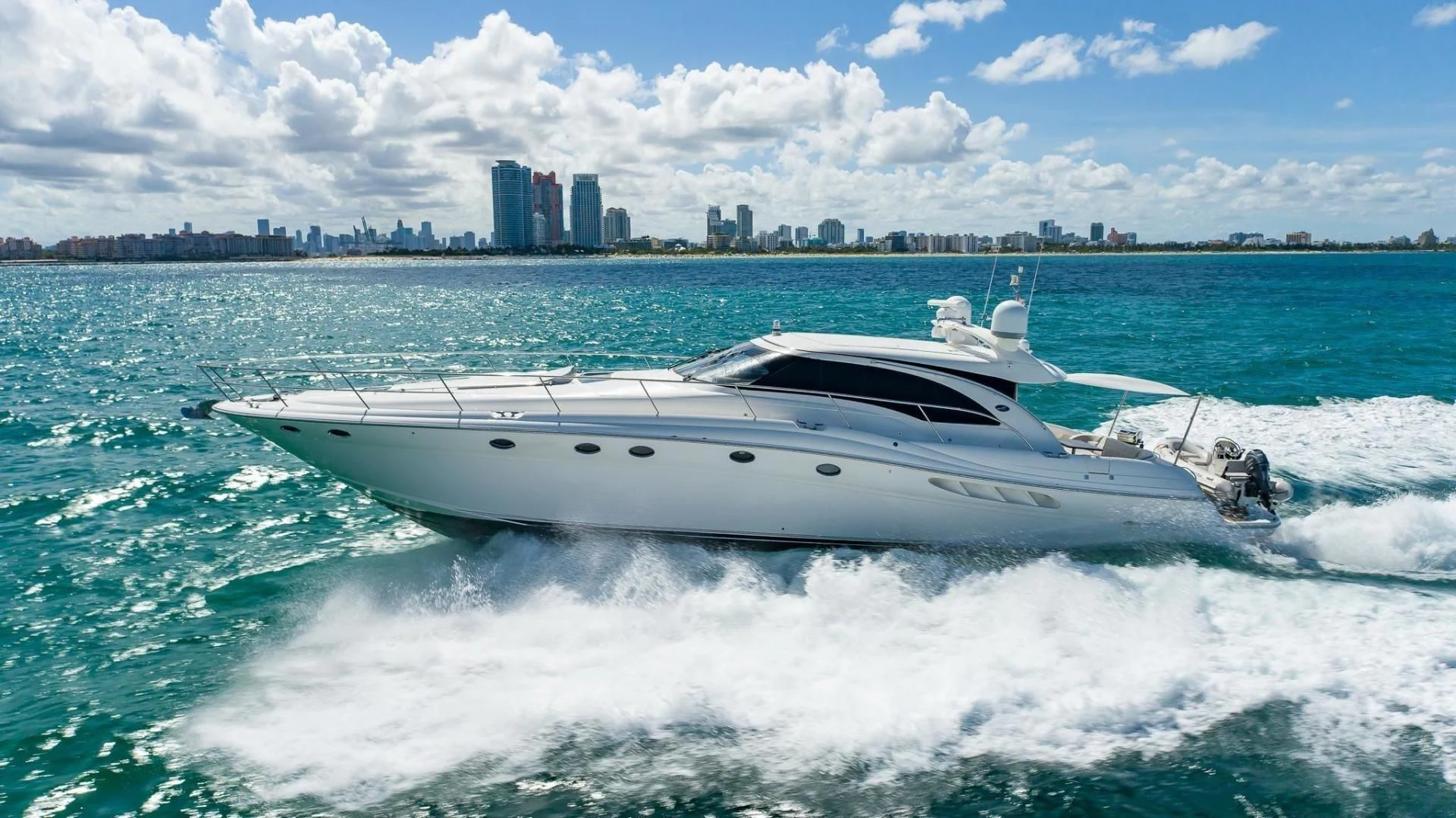 a white yacht in the water aboard XANADU Yacht for Sale