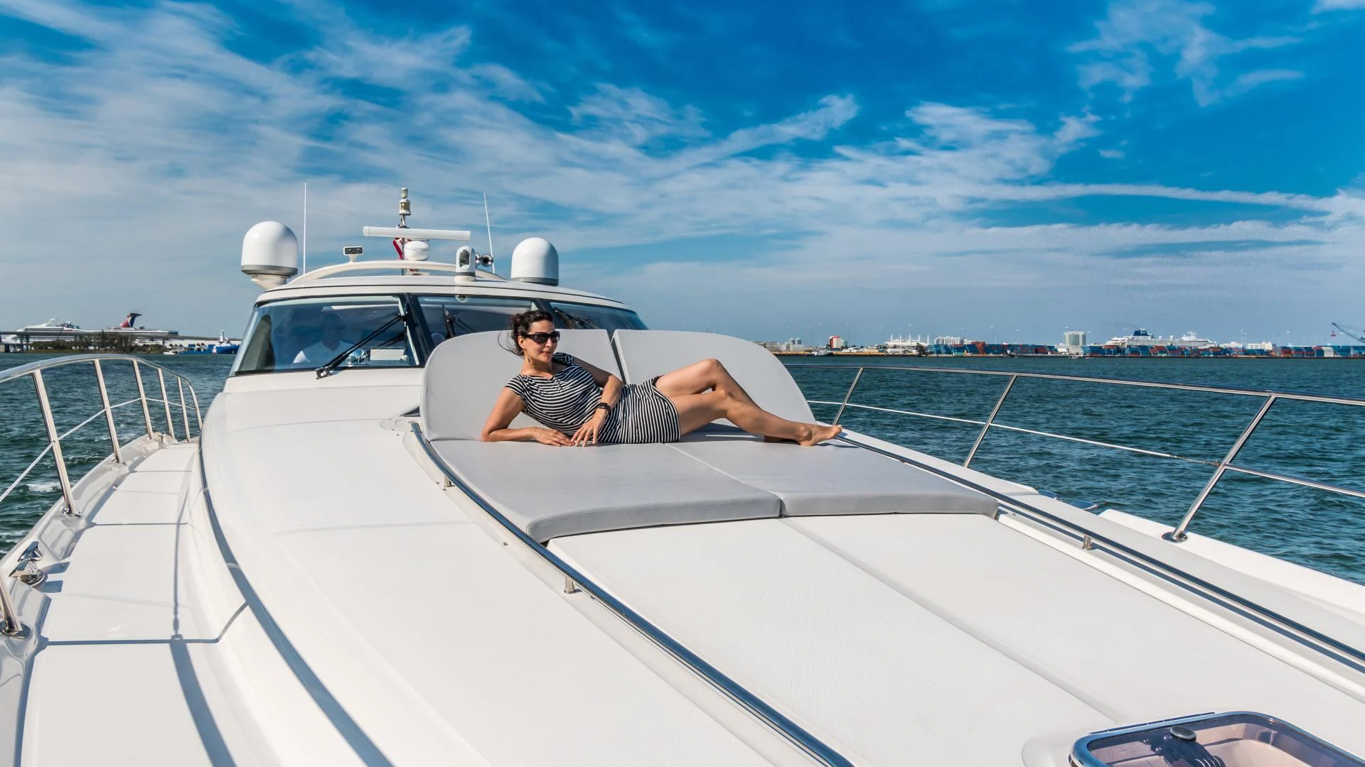a man lying on a boat aboard XANADU Yacht for Sale