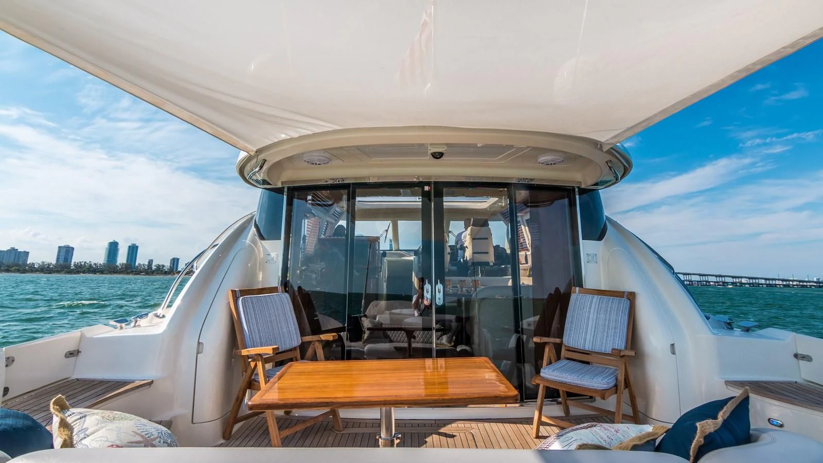 a boat with a table and chairs on the deck aboard XANADU Yacht for Sale
