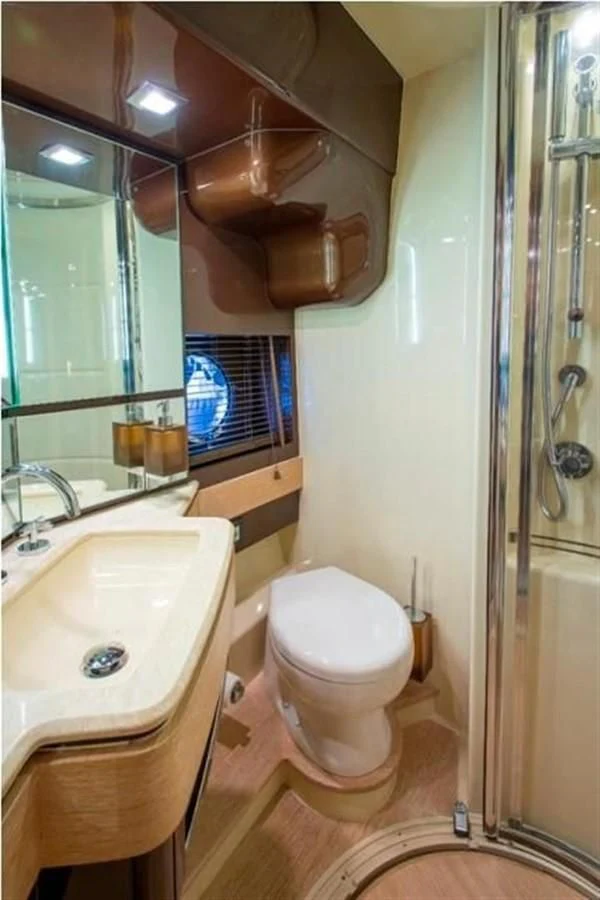 a bathroom with a toilet and sink aboard RAMAYA Yacht for Sale