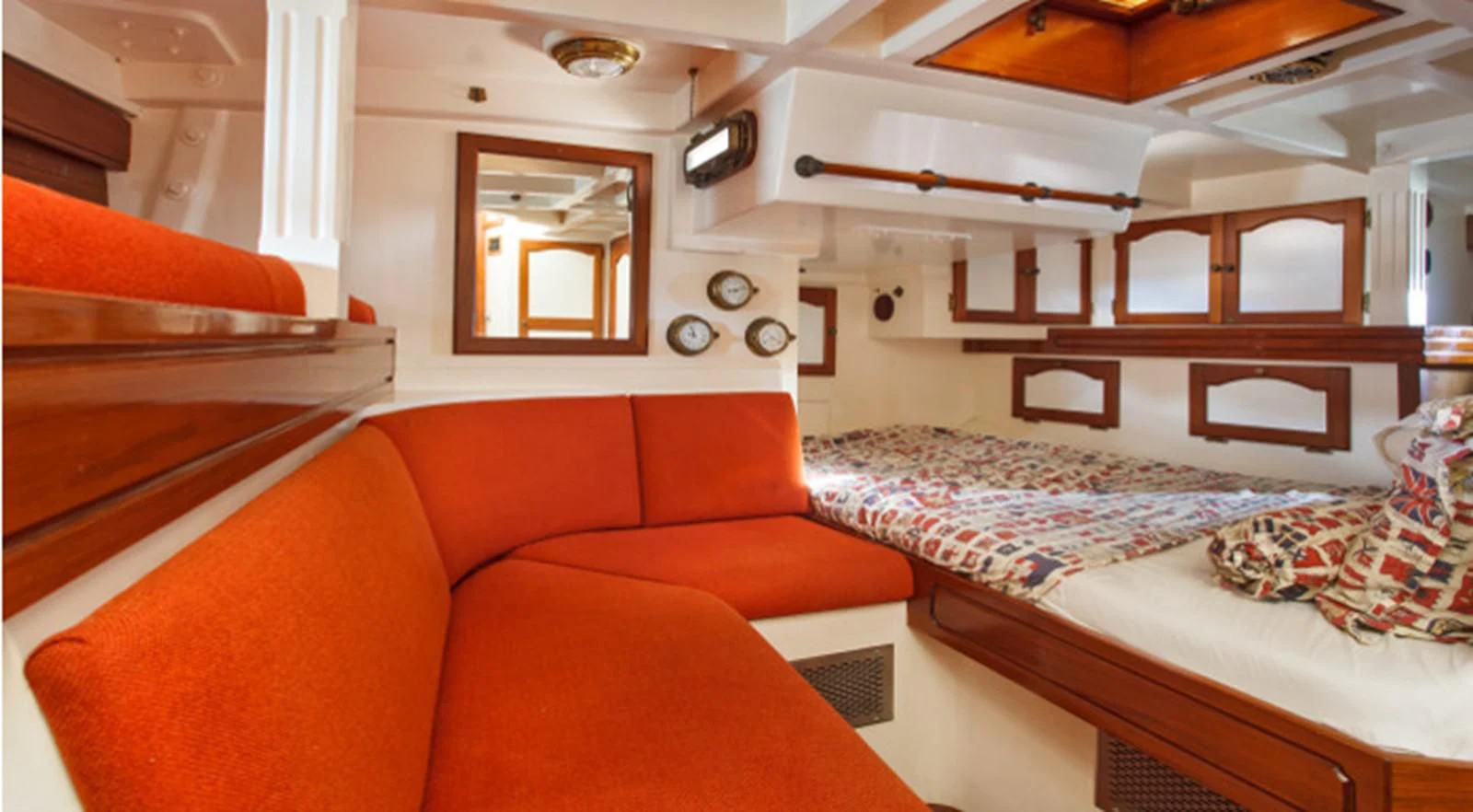 a room with a bed and a couch aboard COPIHUE Yacht for Sale