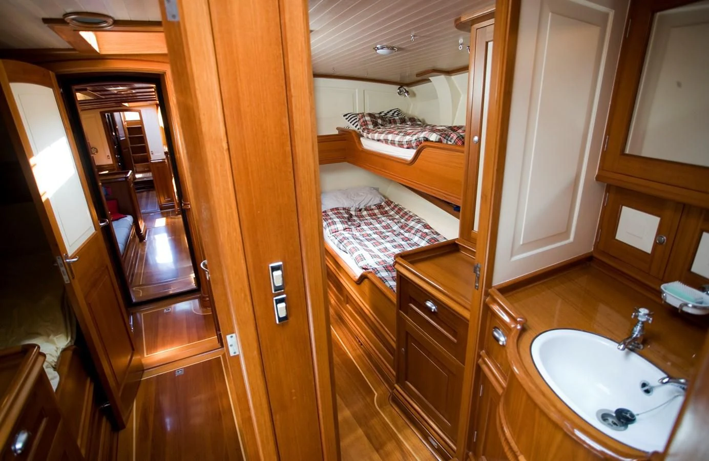 a bathroom with a large mirror aboard COPIHUE Yacht for Sale