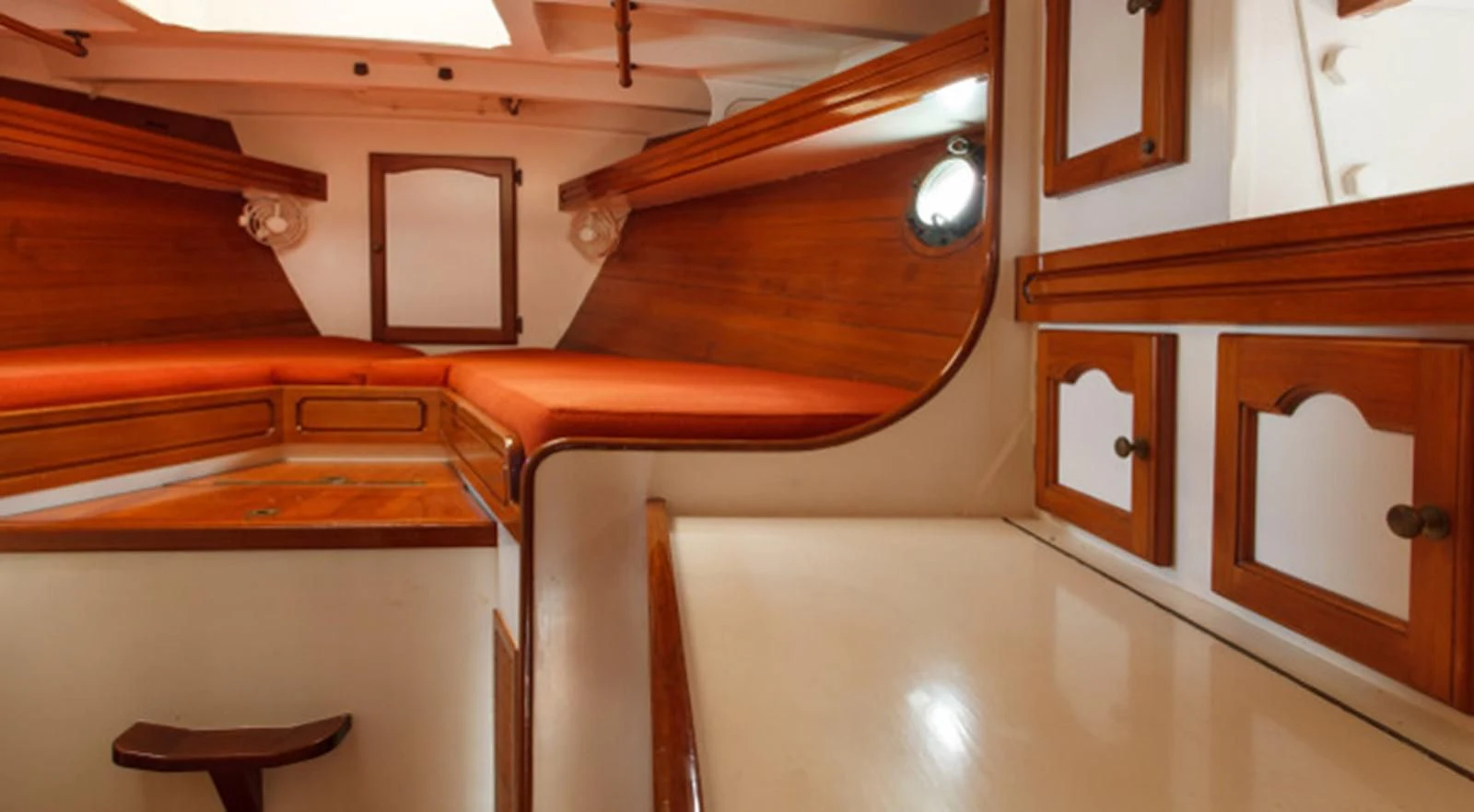 a room with a bed and a desk aboard COPIHUE Yacht for Sale