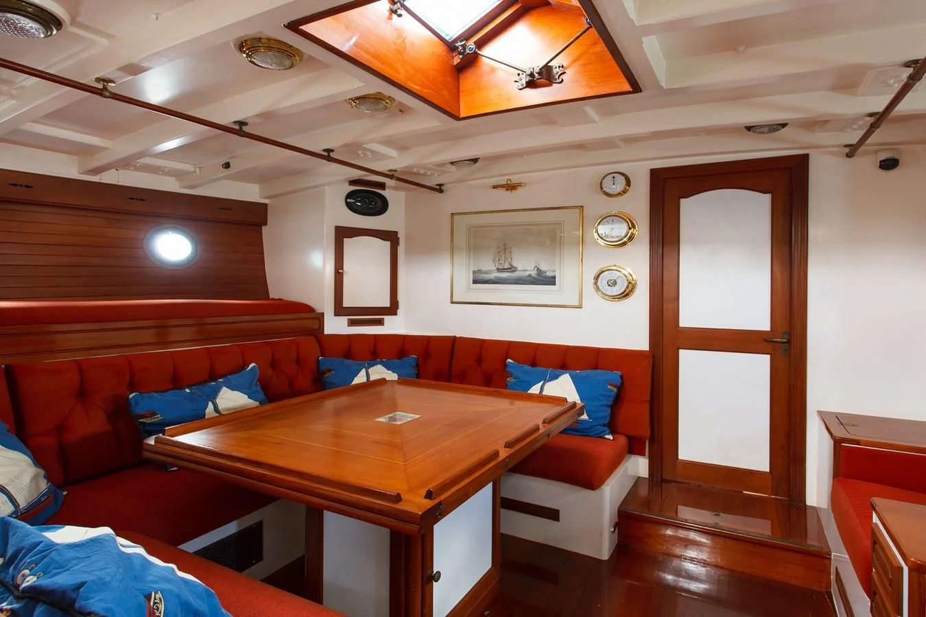 a room with a table and chairs aboard COPIHUE Yacht for Sale