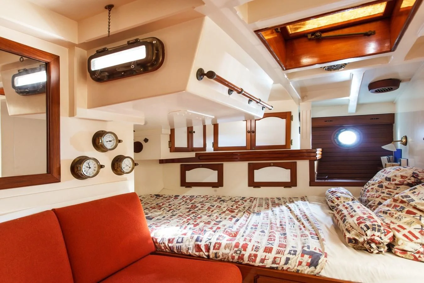 a room with a bed and a couch aboard COPIHUE Yacht for Sale