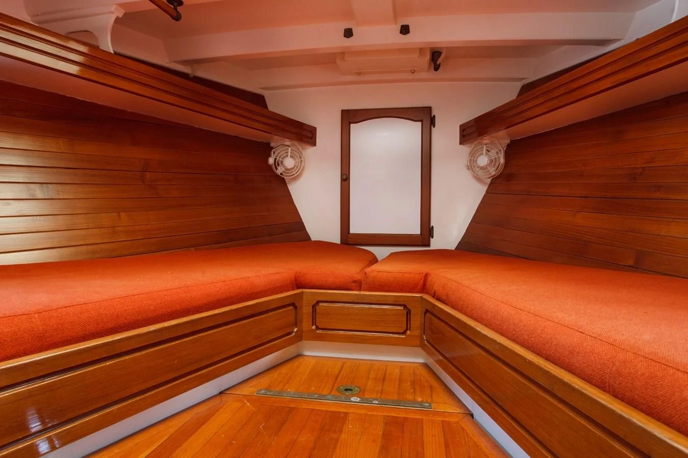 a room with wooden furniture aboard COPIHUE Yacht for Sale