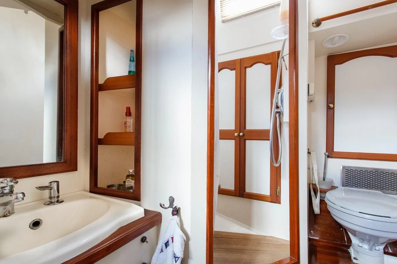 a bathroom with a toilet and sink aboard COPIHUE Yacht for Sale