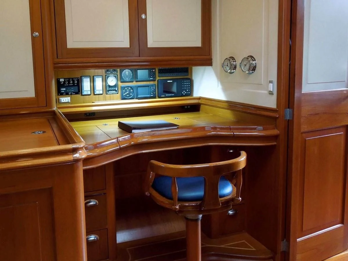 a kitchen with wooden cabinets aboard COPIHUE Yacht for Sale
