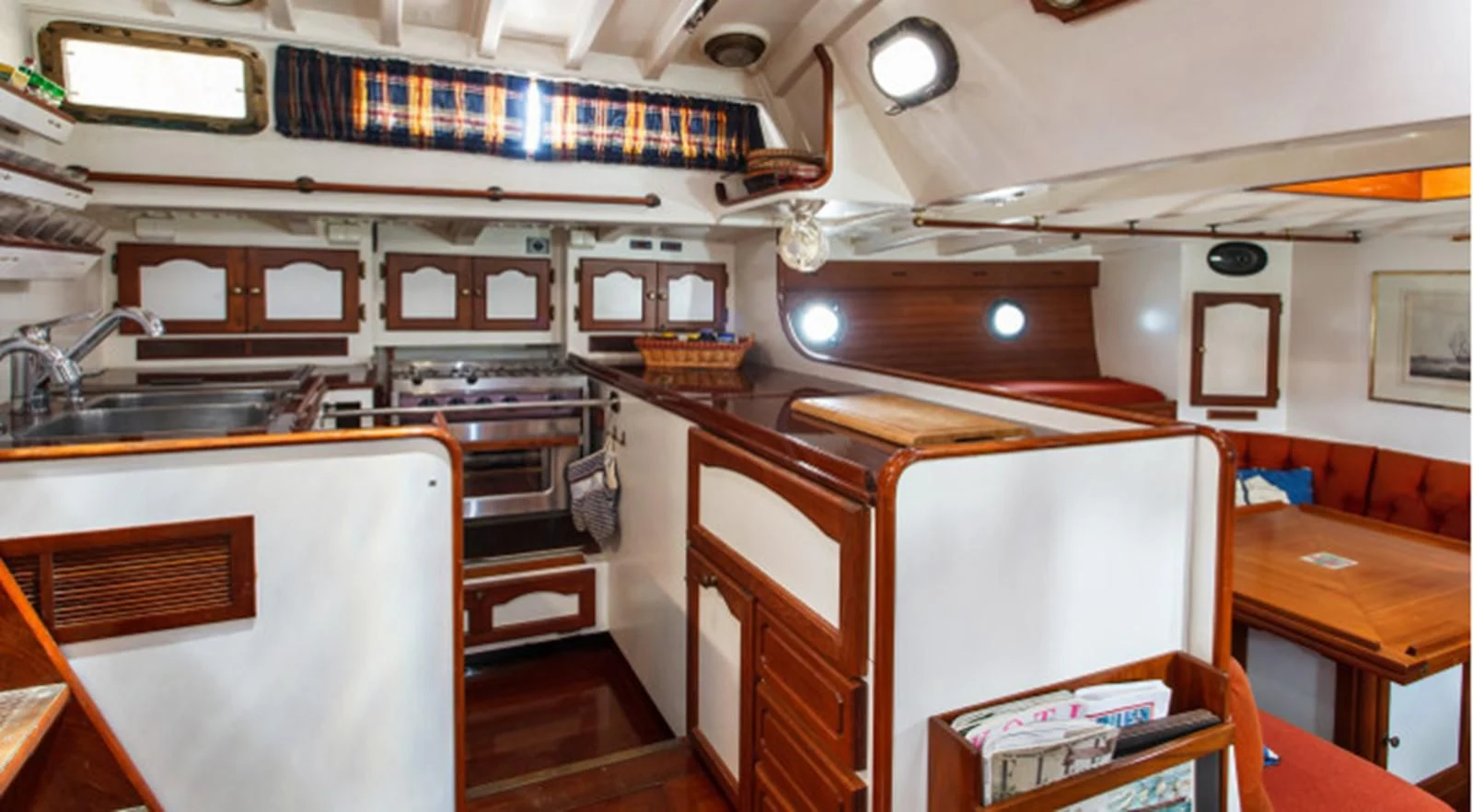 a kitchen with a stove and cabinets aboard COPIHUE Yacht for Sale