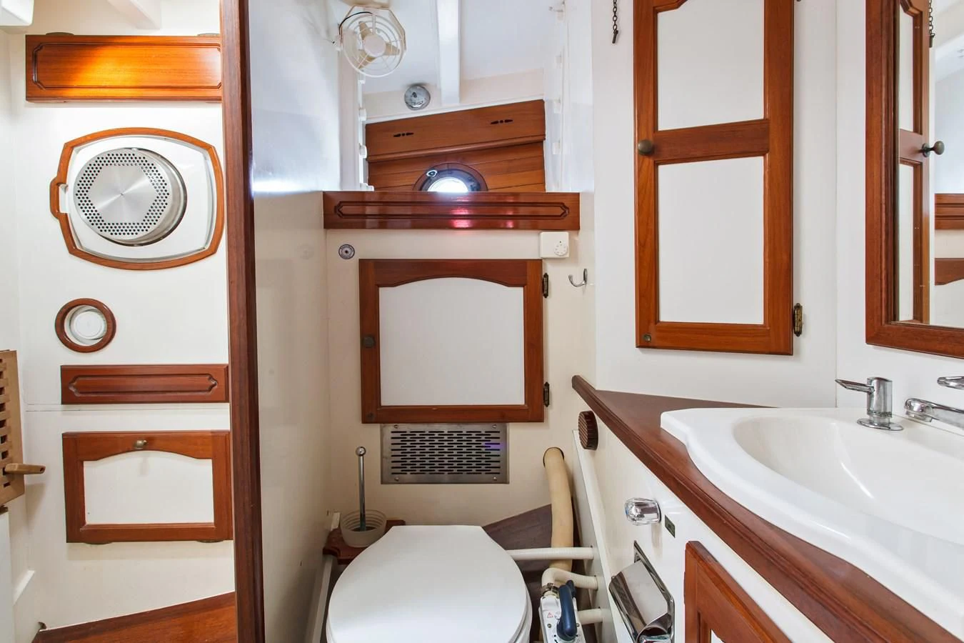a bathroom with a toilet and a sink aboard COPIHUE Yacht for Sale