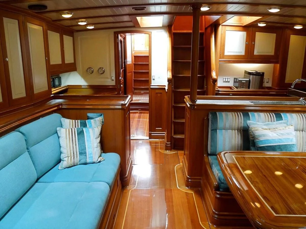 a kitchen with wooden cabinets aboard COPIHUE Yacht for Sale