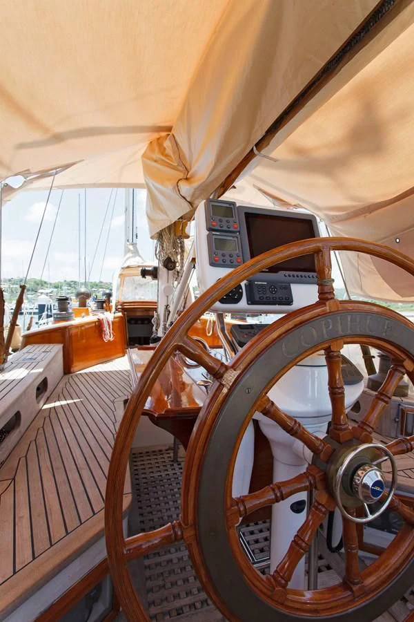 a large boat with a steering wheel aboard COPIHUE Yacht for Sale
