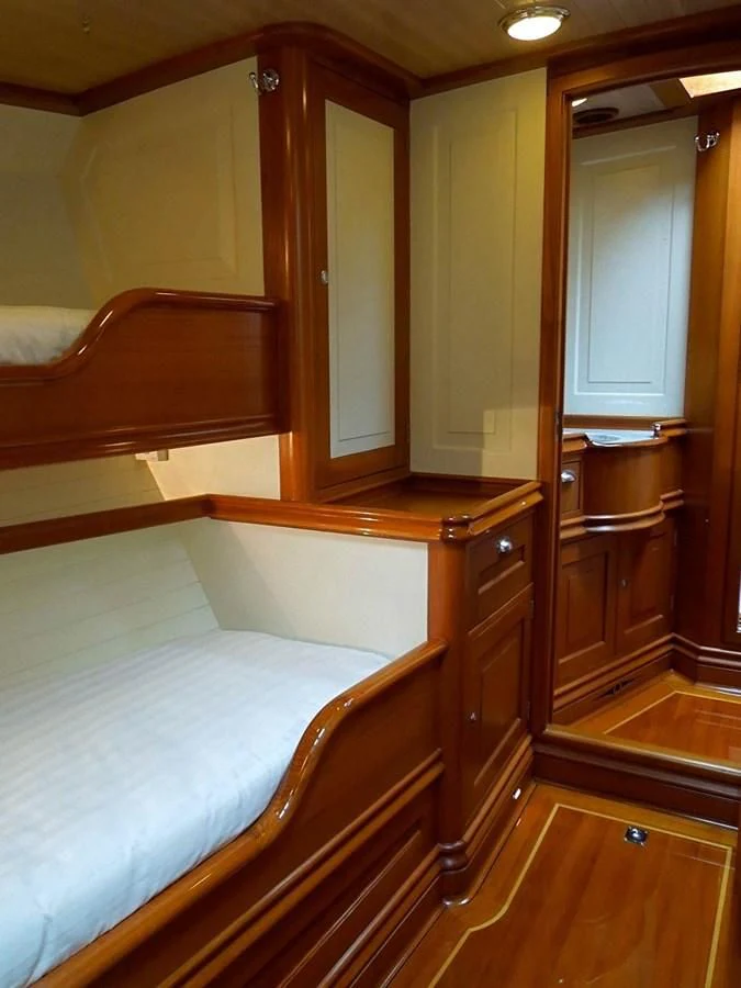 a bedroom with a bed aboard COPIHUE Yacht for Sale