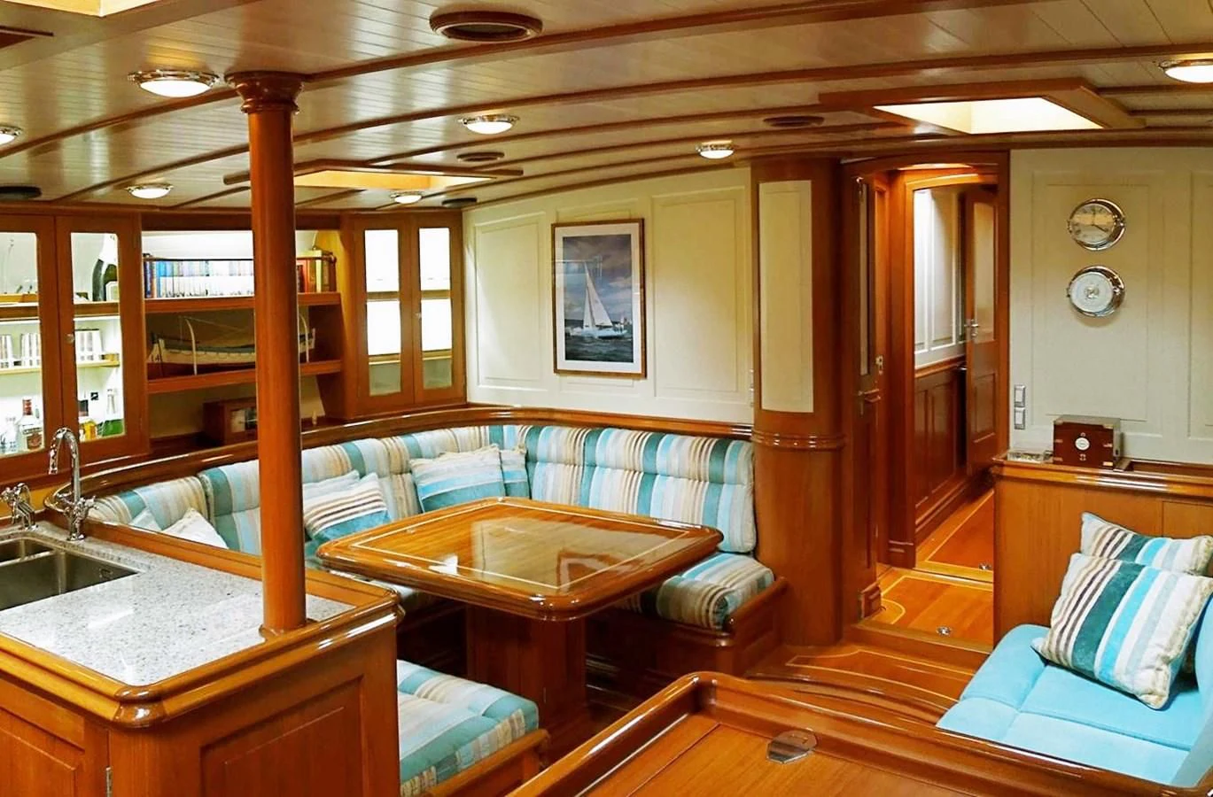 a room with a bed and a table aboard COPIHUE Yacht for Sale