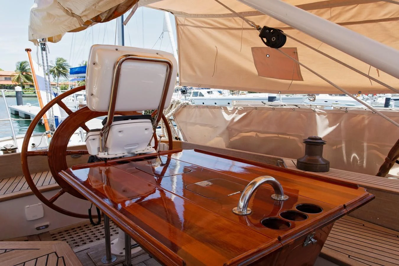a wooden boat with a steering wheel aboard COPIHUE Yacht for Sale