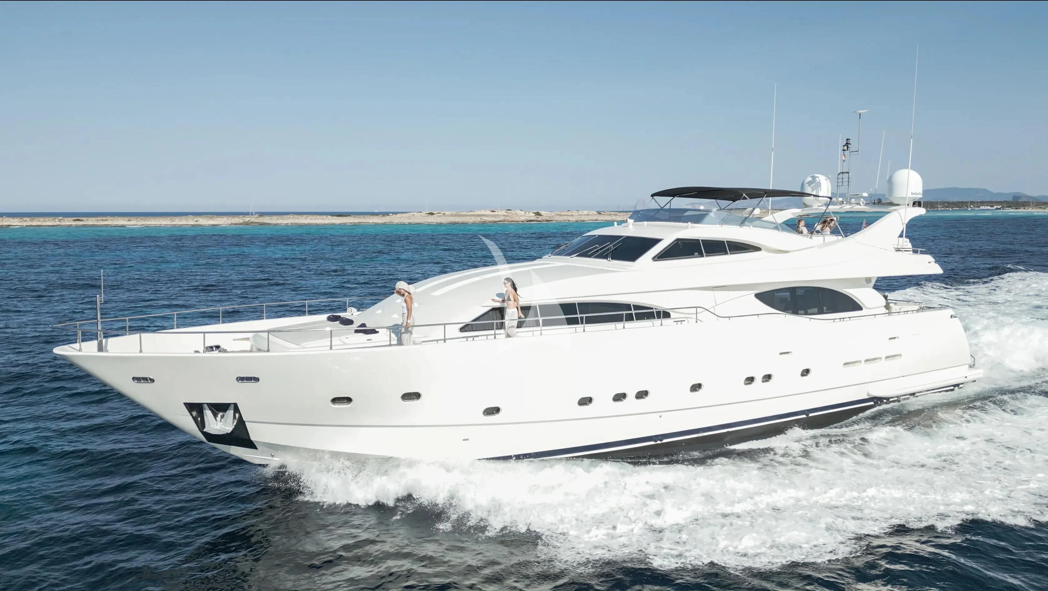 a white yacht on the water aboard YOLO TOO Yacht for Charter