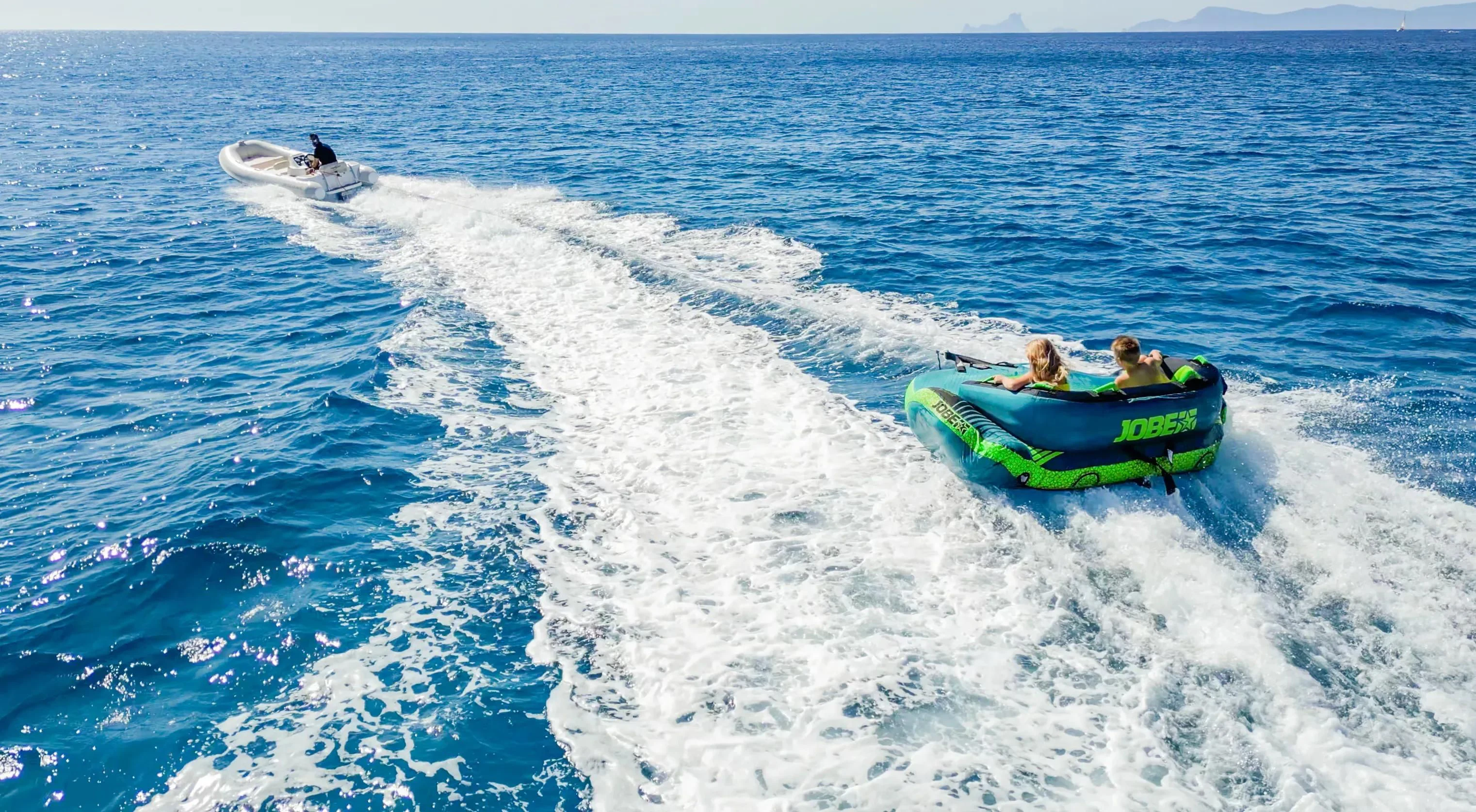 people on a raft in the water aboard YOLO TOO Yacht for Charter