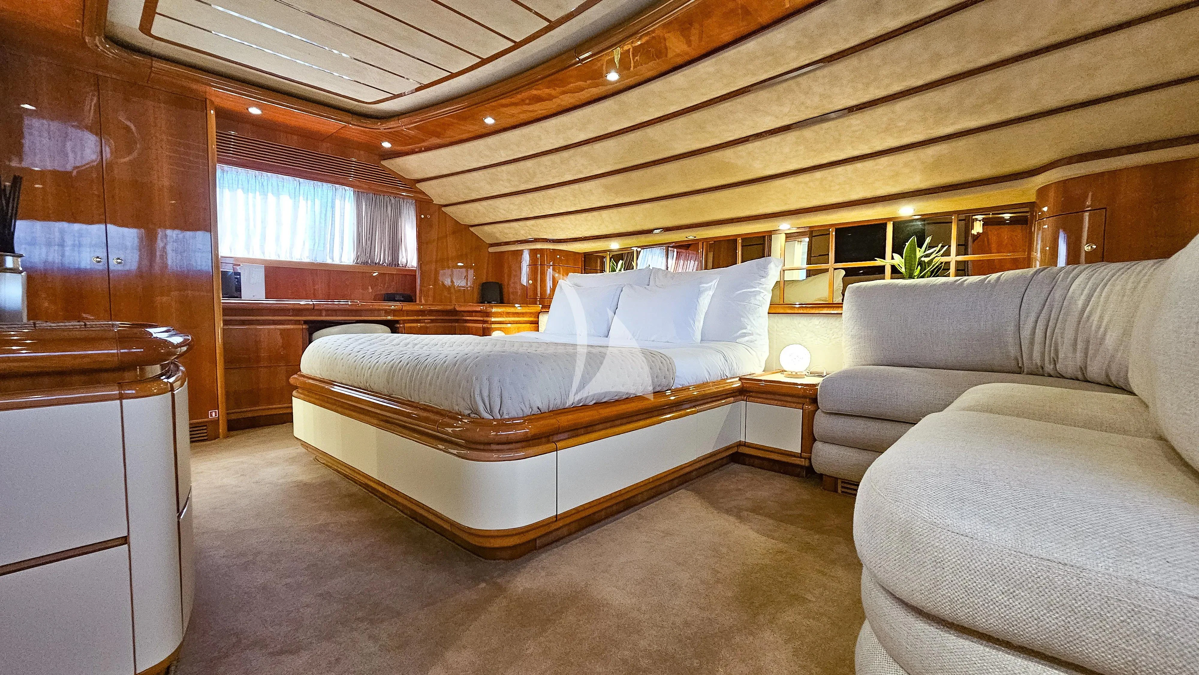 a large bed in a room aboard YOLO TOO Yacht for Charter