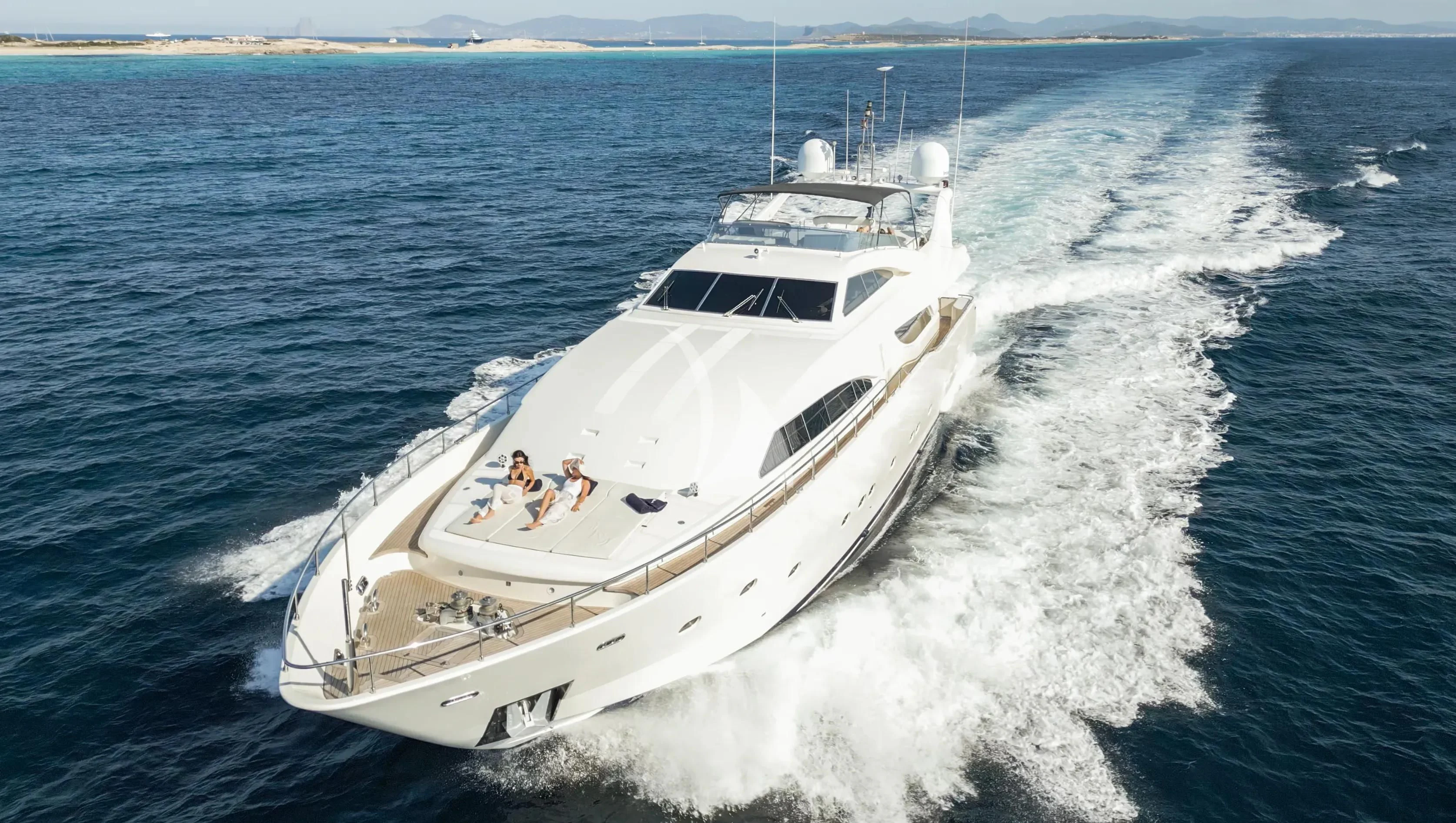 a white yacht on the water aboard YOLO TOO Yacht for Charter