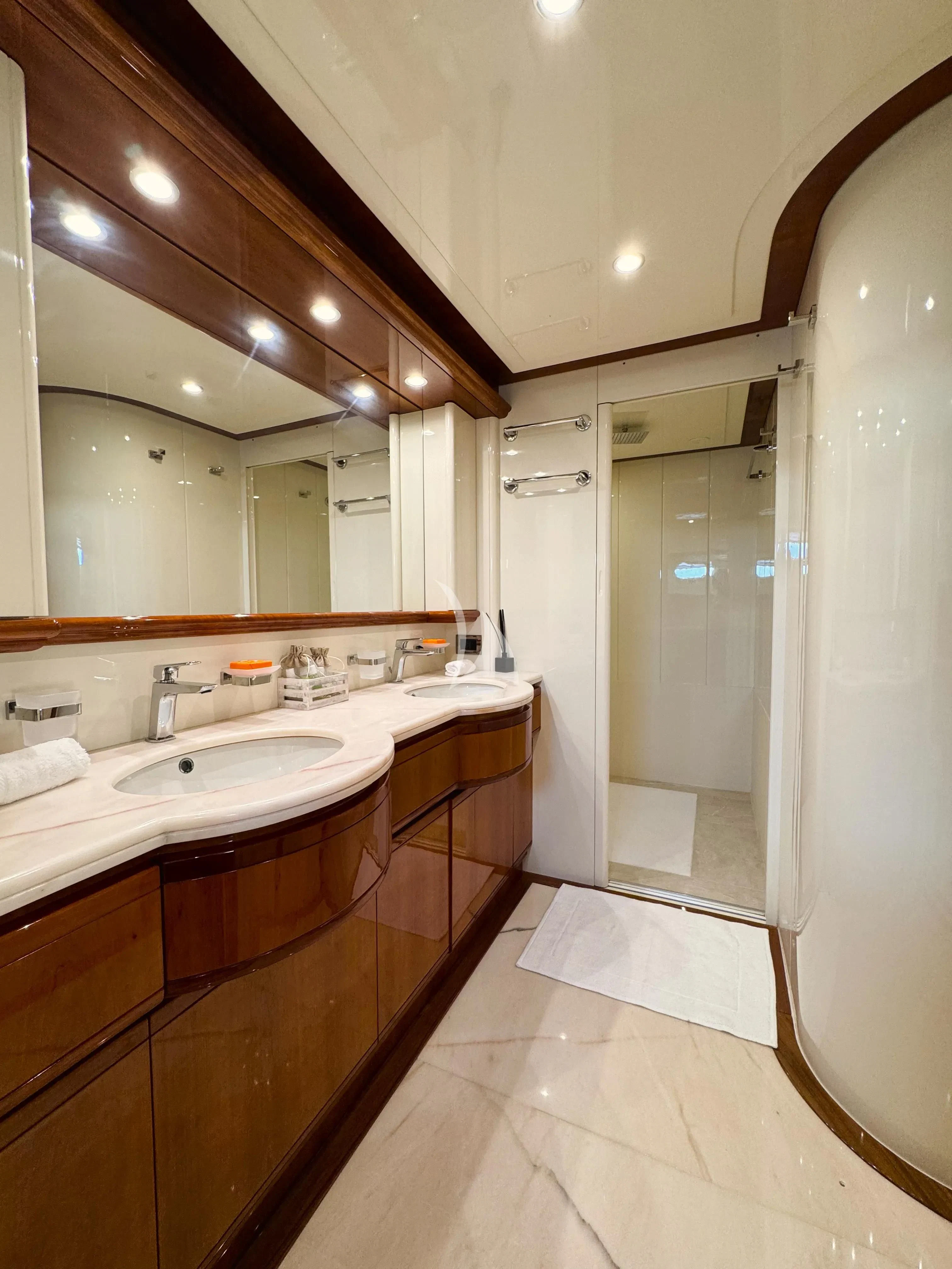 a bathroom with a large mirror aboard YOLO TOO Yacht for Charter
