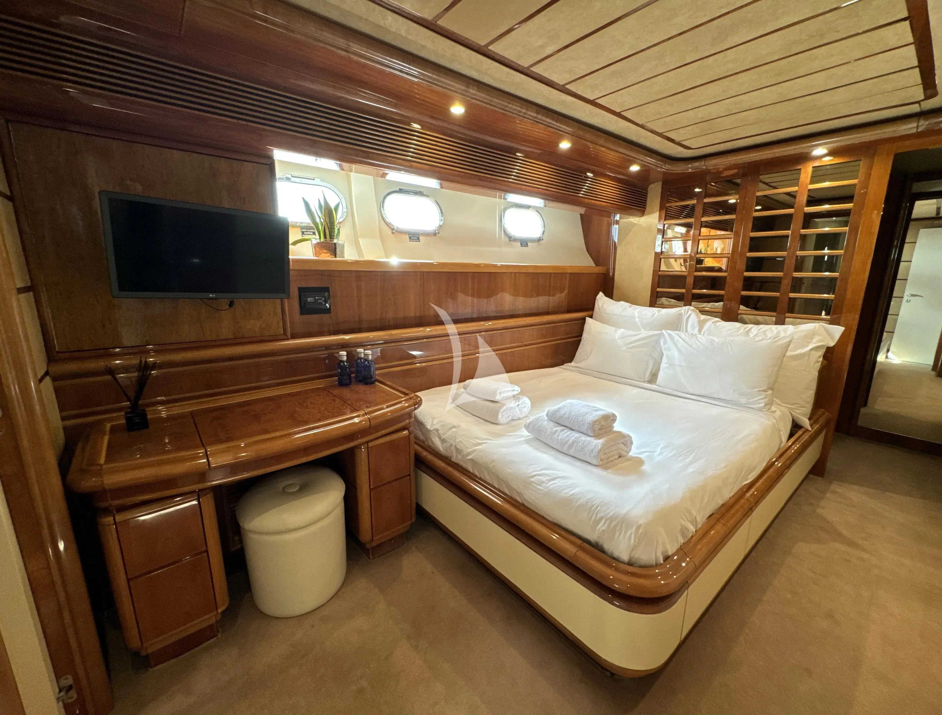 a bed in a cabin aboard YOLO TOO Yacht for Charter