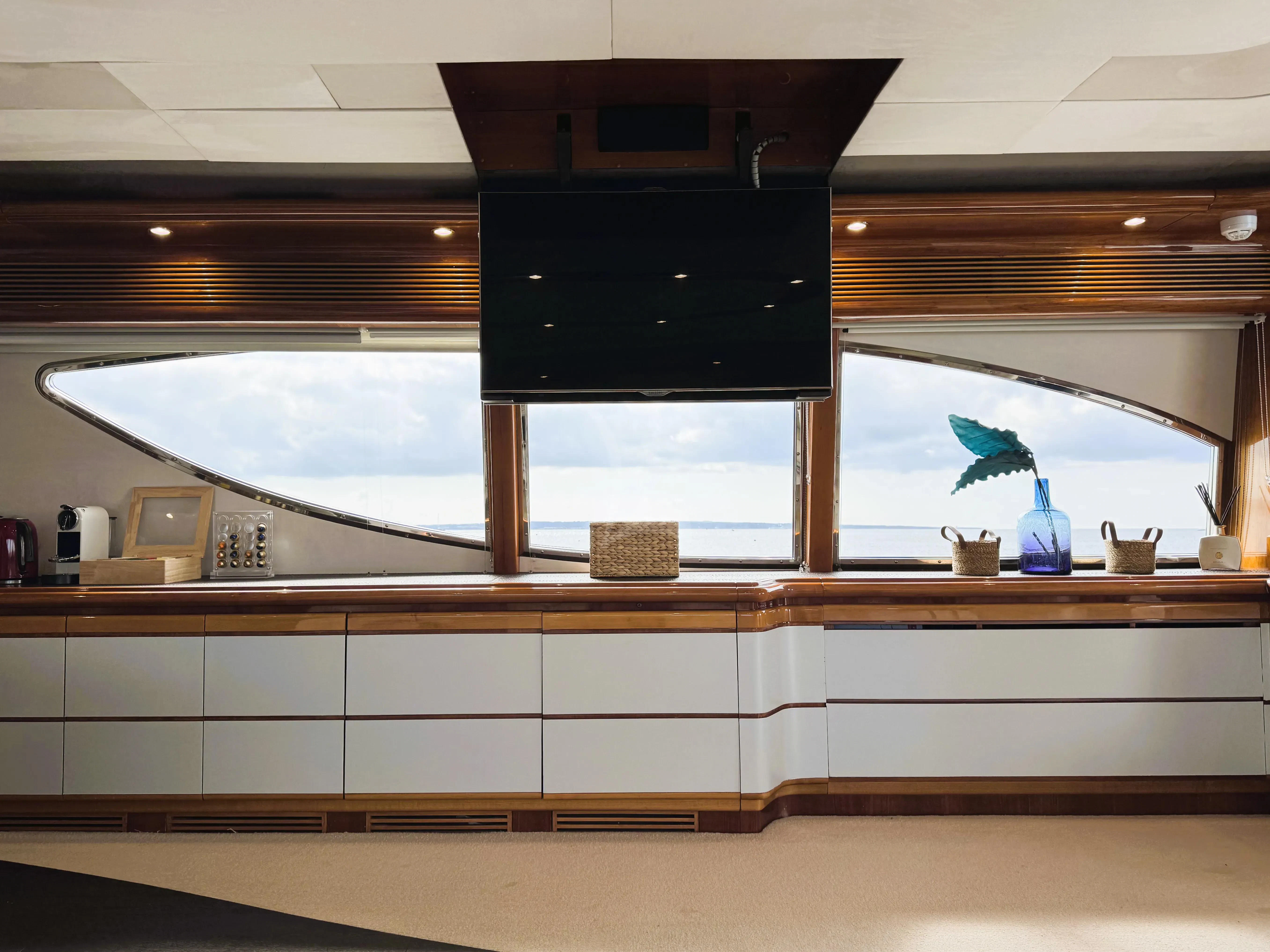 a room with a large window aboard YOLO TOO Yacht for Charter